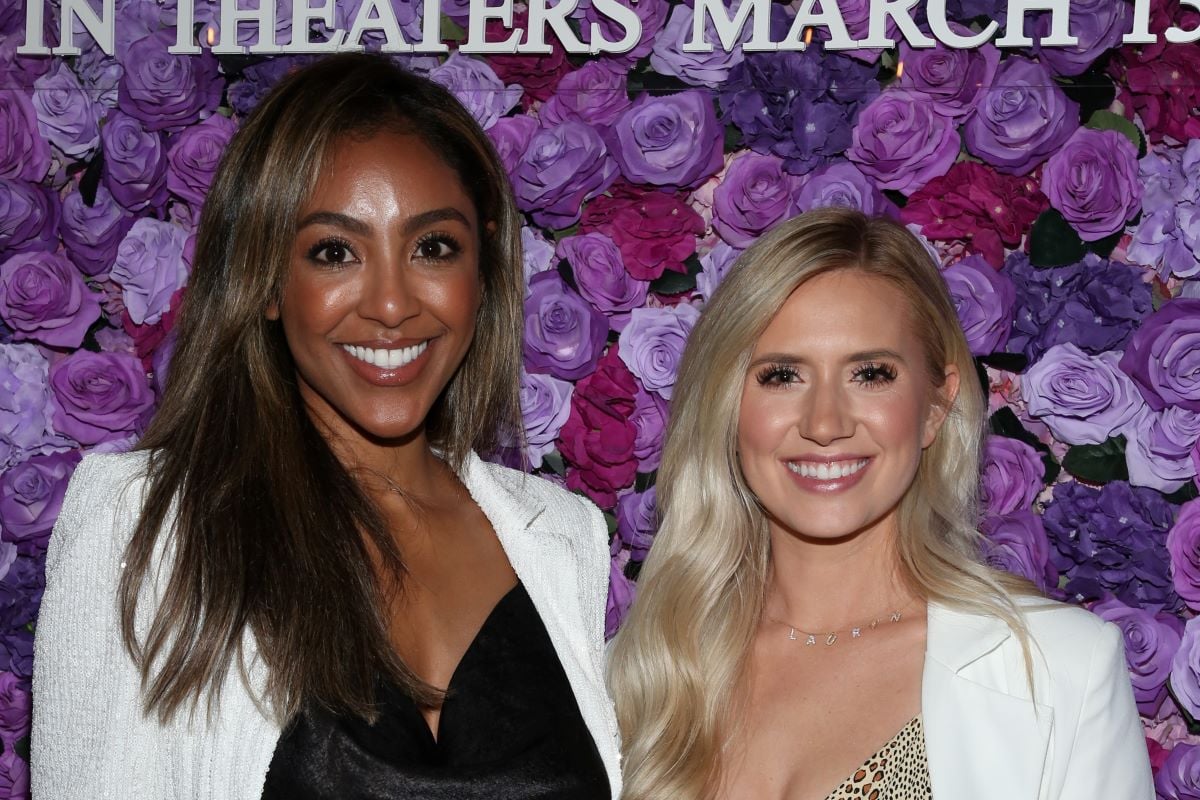 'The Bachelorette' star Tayshia Adams in a black shirt and white blazer and Lauren Burnham in a white blazer