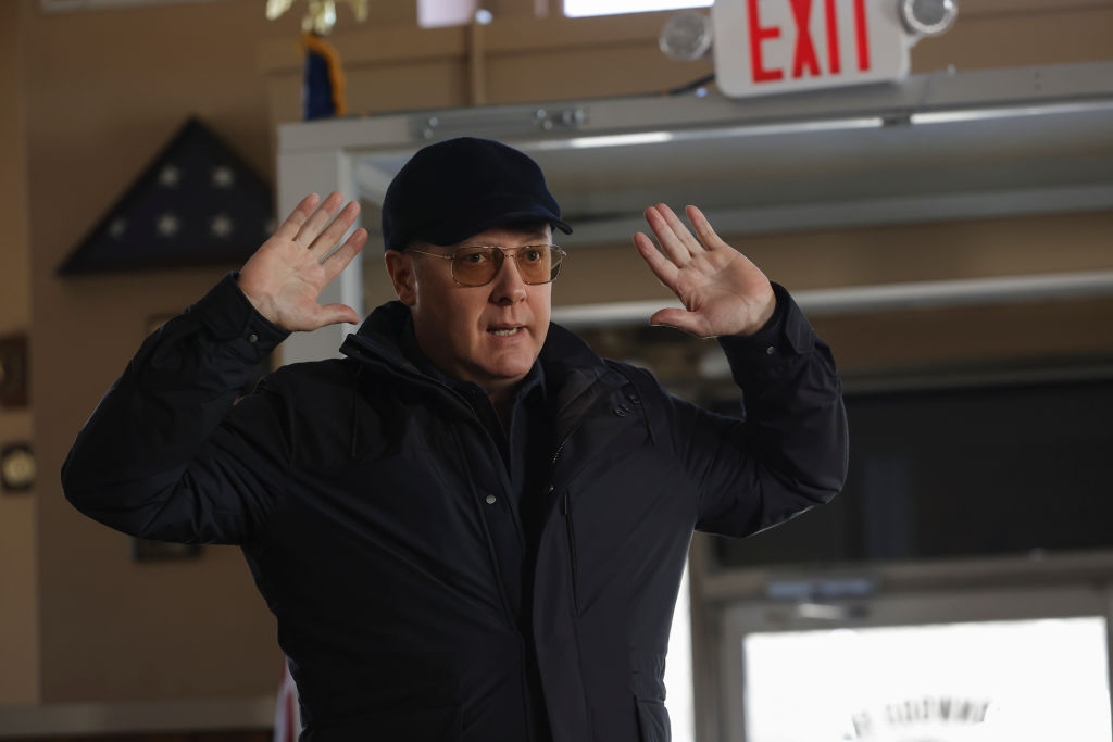 James Spader as Raymond 'Red' Reddington stands with his hands up on season 8 of 'The Blacklist'