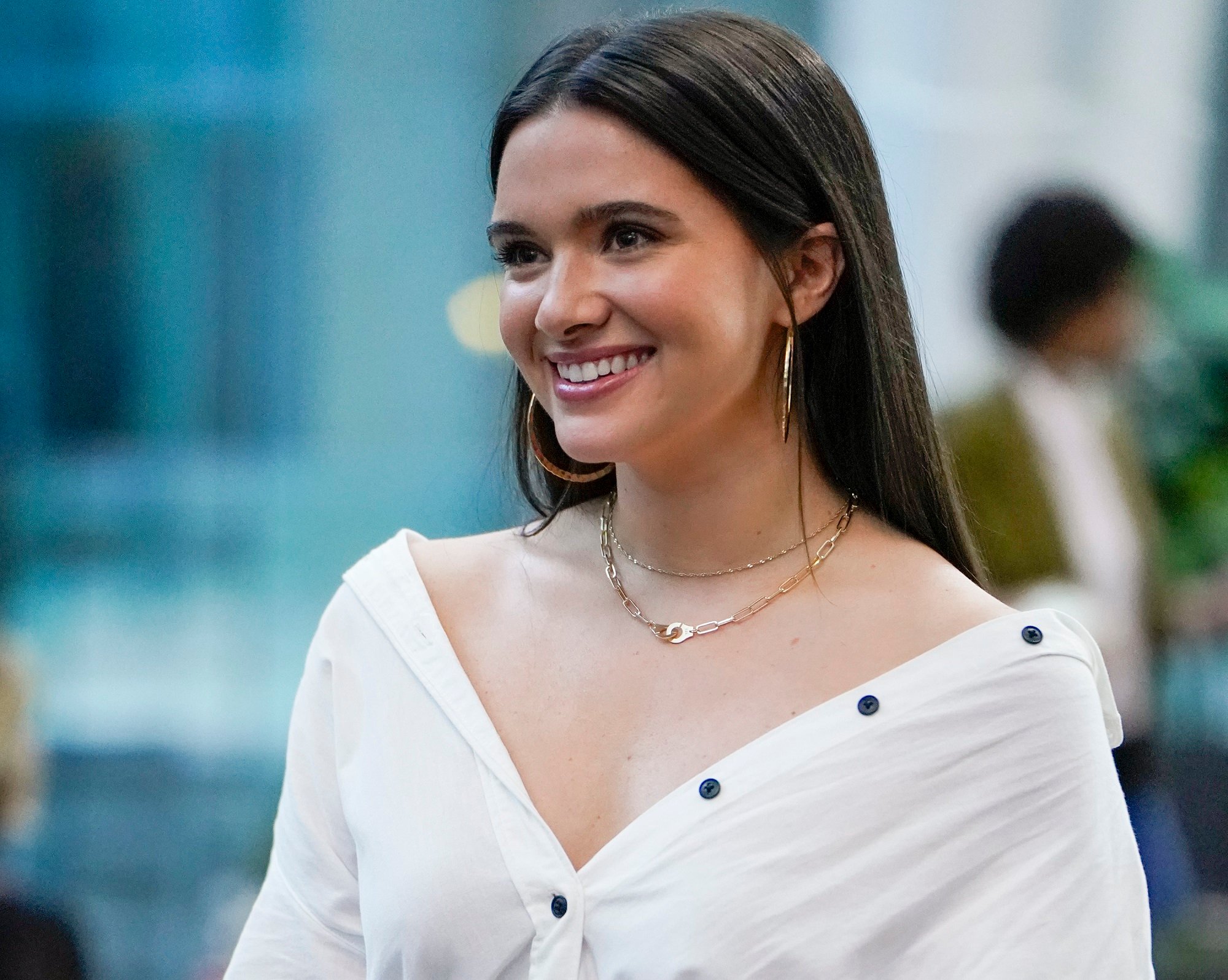 Jane smiles while wearing a white blouse in season 5 of 'The Bold Type'