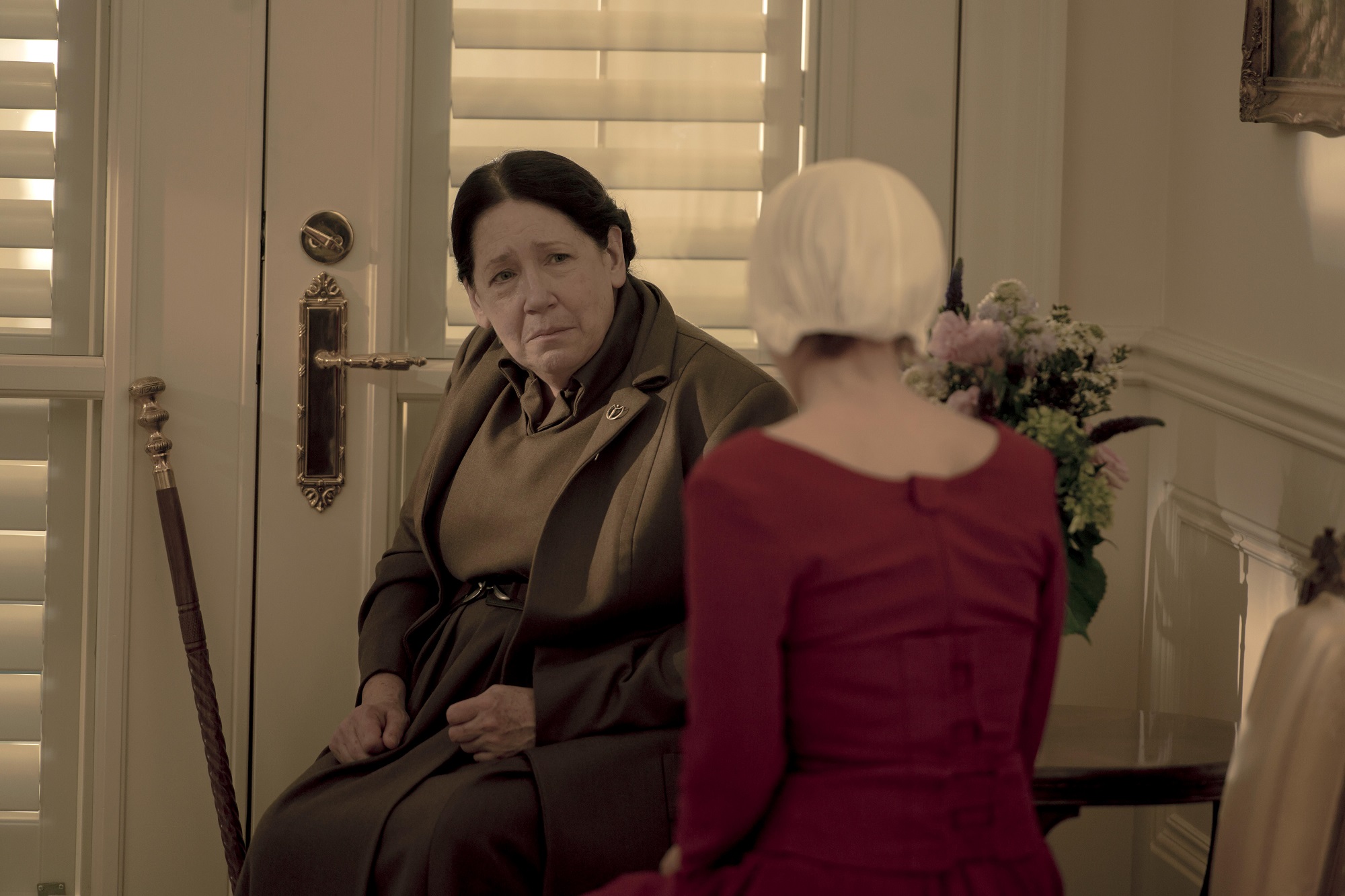 Aunt Lydia and Janine sit together in season 3 of 'The Handmaid's Tale'