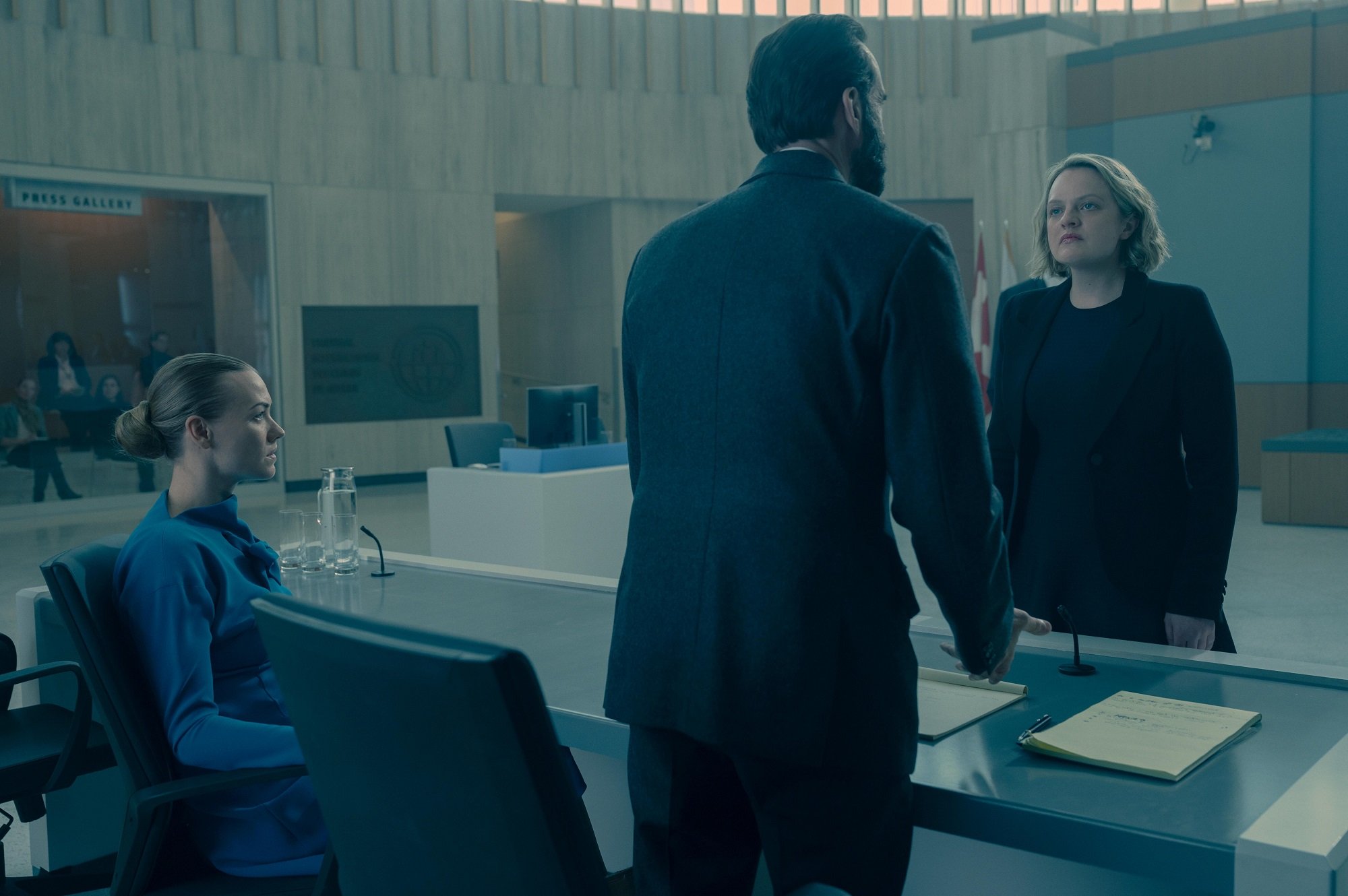 Serena Joy Waterford, Fred Waterford, and June Osborne in a courtroom in season 4 episode 8 of 'The Handmaid's Tale'