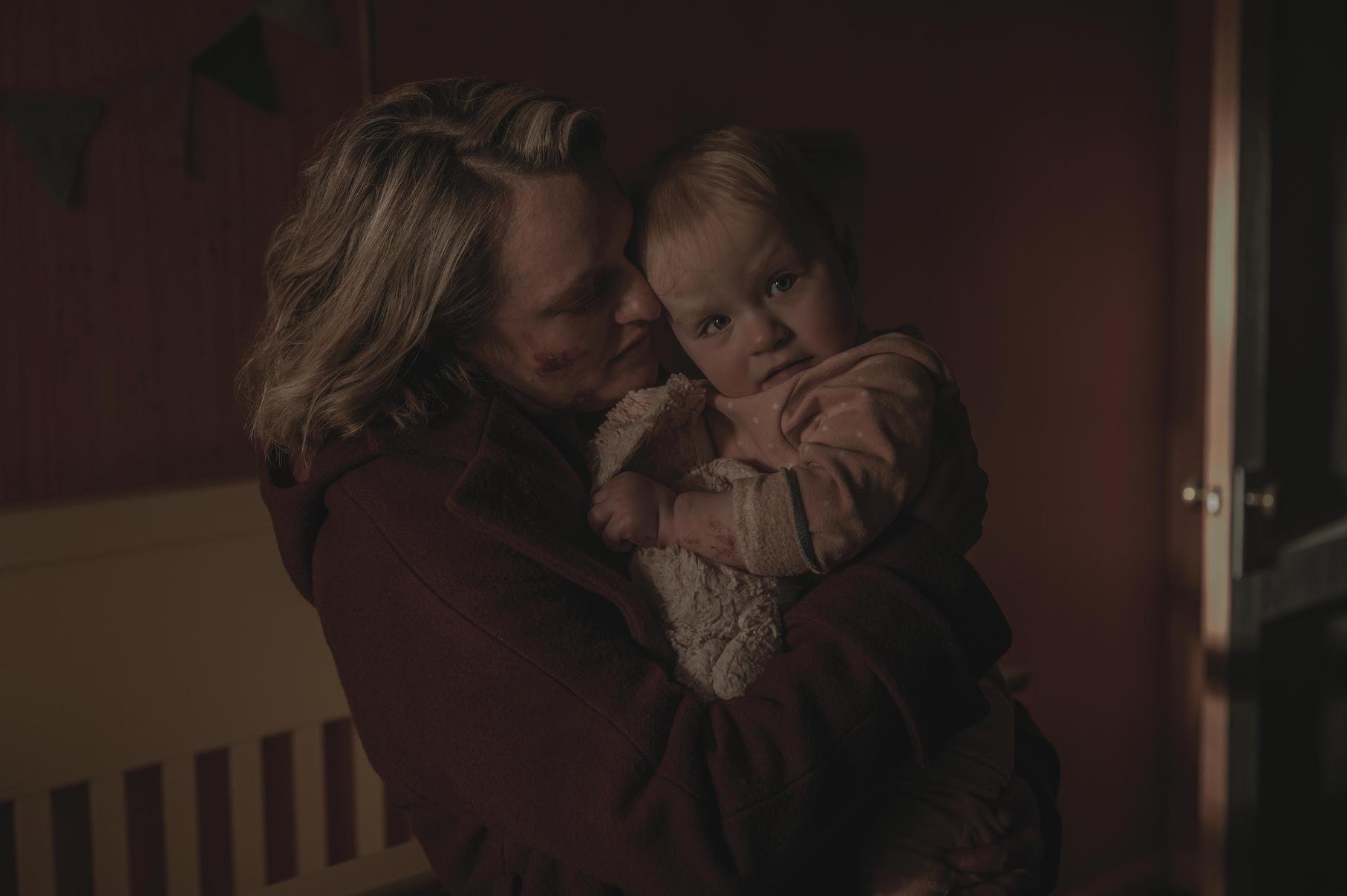 A bloody June Osborne holding her baby at the end of 'The Handmaid's Tale' Season 4