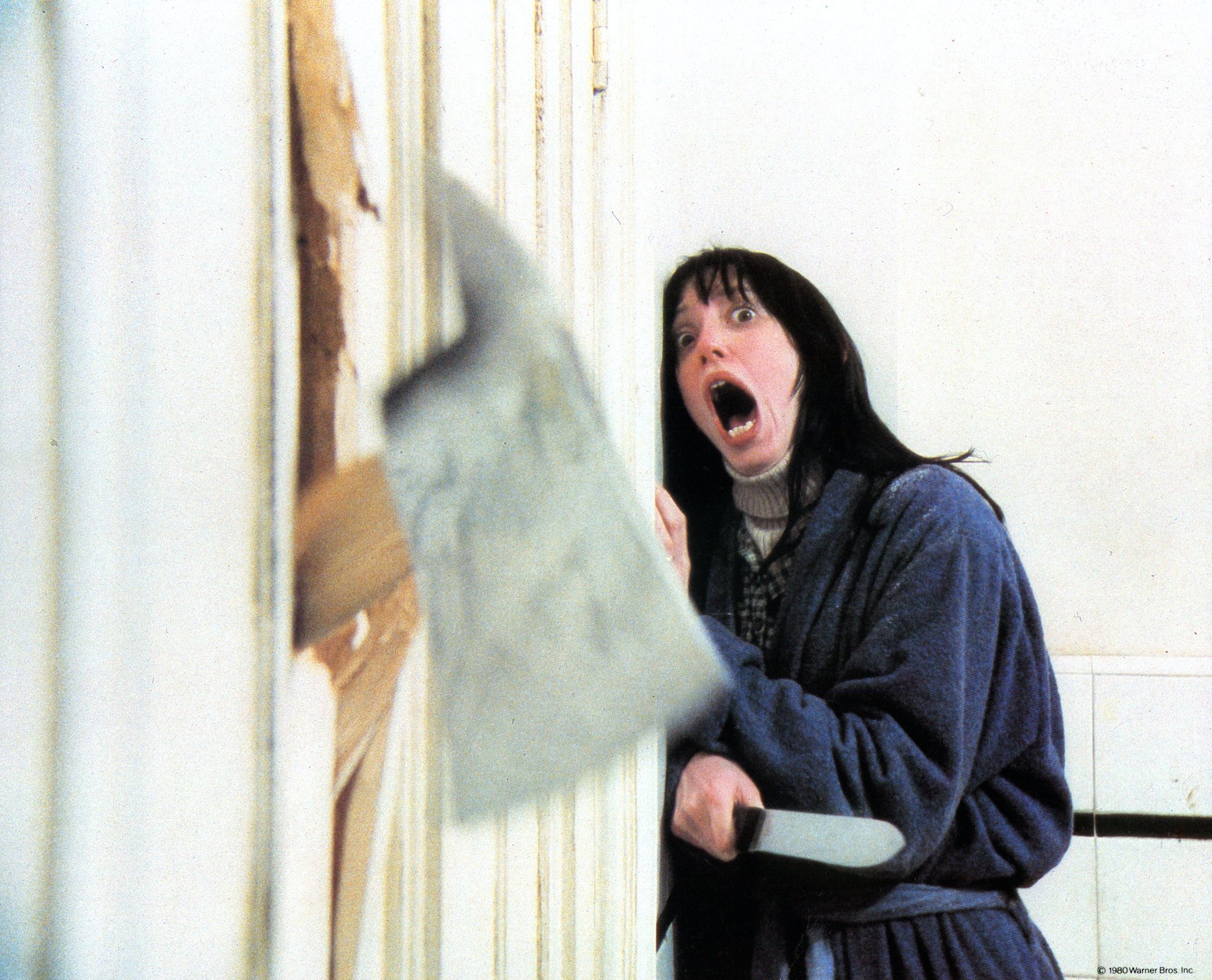 Shelley Duvall screaming, behind an ax, in 'The Shining'