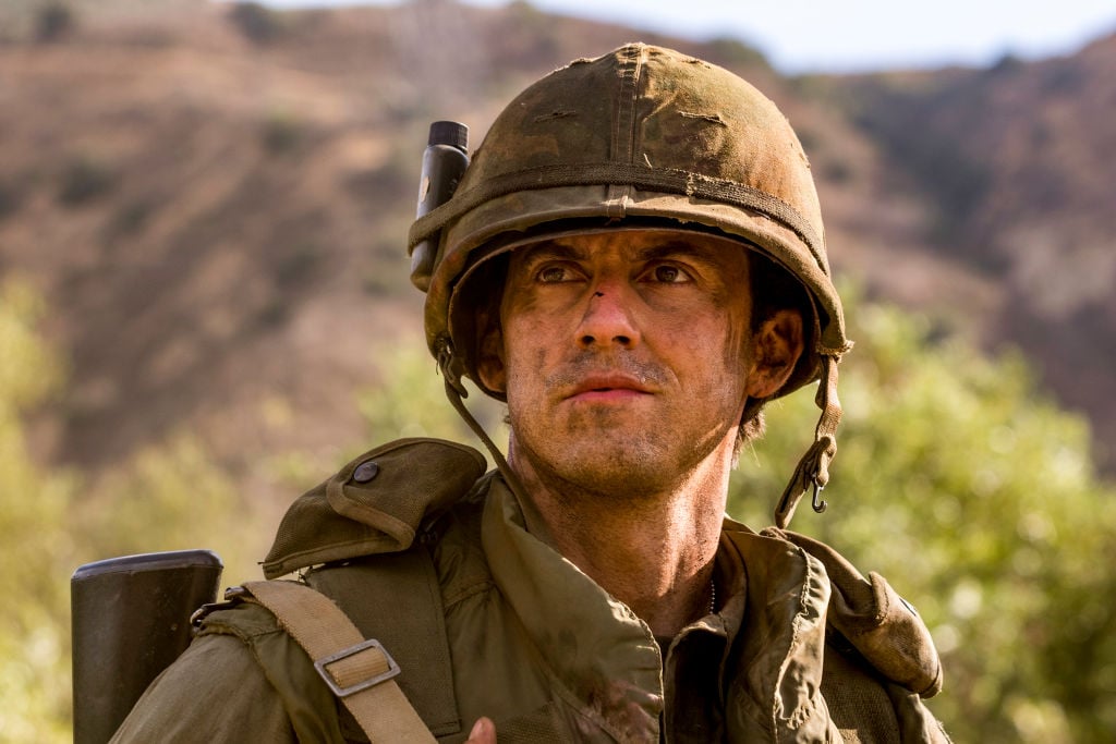 Milo Ventimiglia as Jack Pearson looks concerned, dressed in army gear.