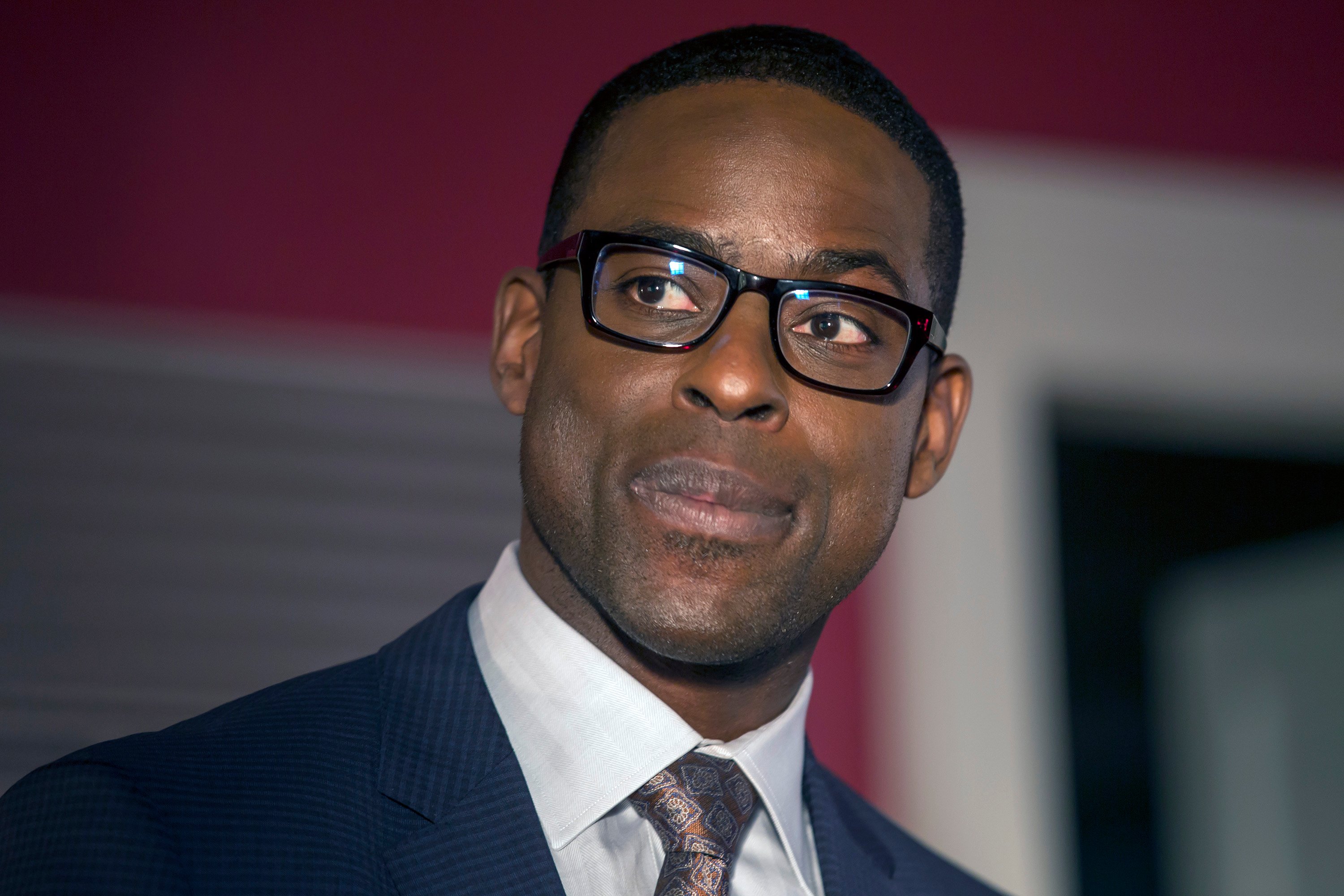 'This Is Us' star Sterling K. Brown smiling as Randall Pearson during an episode.