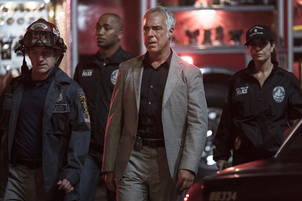 Harry Bosch surrounded by firefighters and paramedics in episode of Bosch Season 7