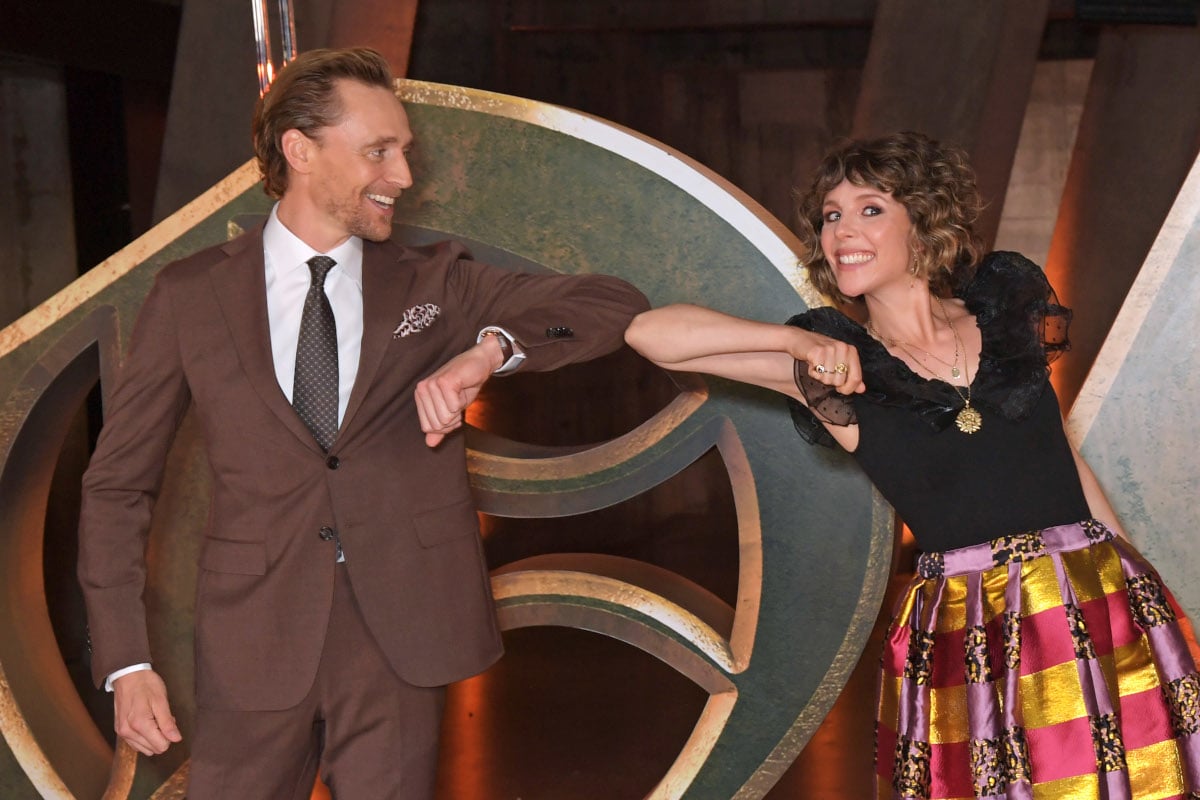 Tom Hiddleston and Sophia Di Martino bump elbows during screening of Loki