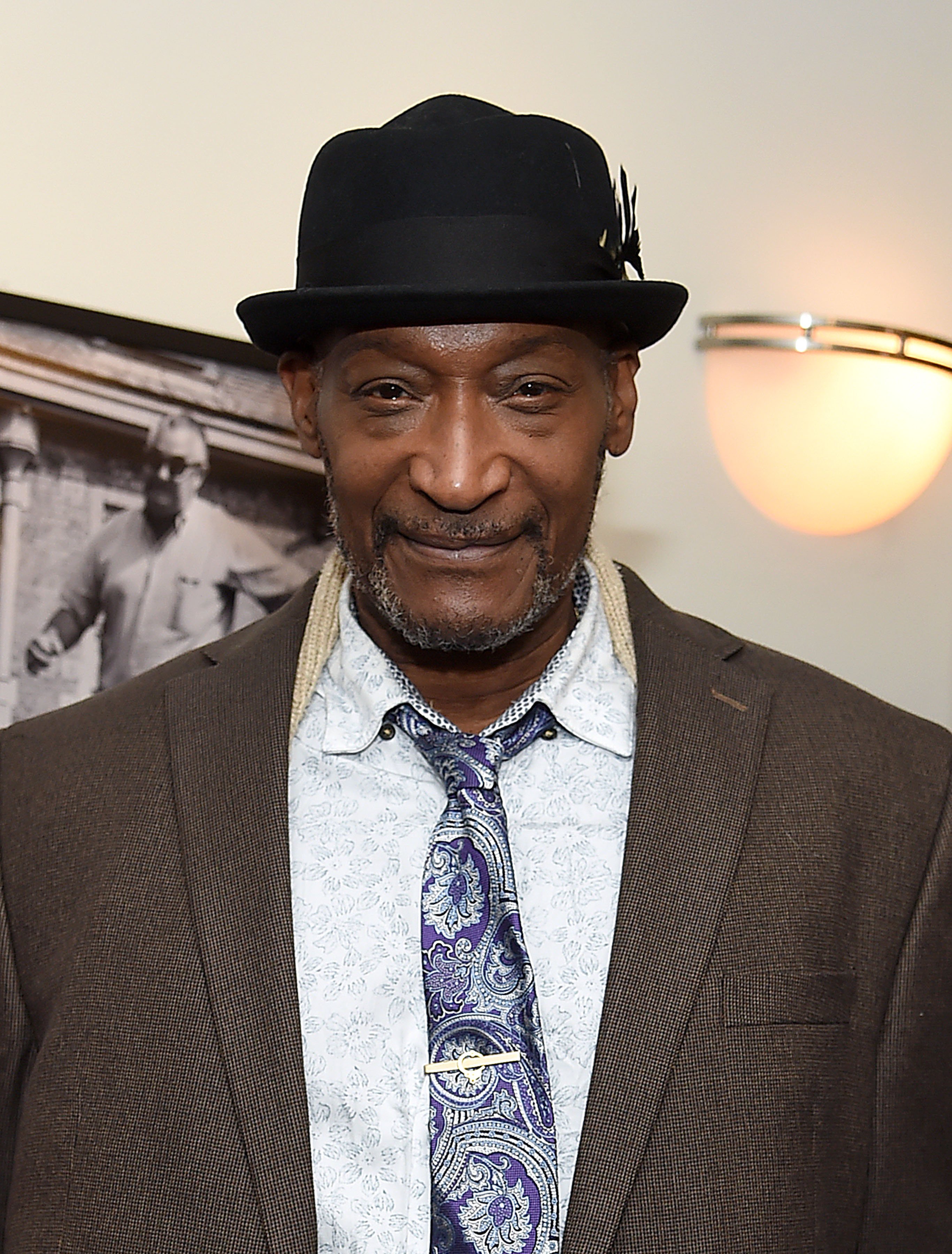 Tony Todd wearing a suit and a hat