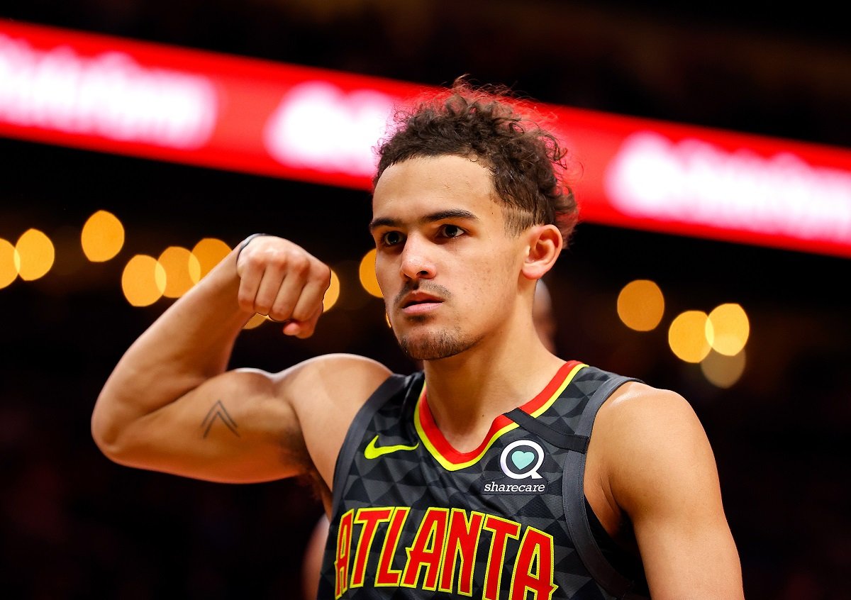 Trae Young of the Atlanta Hawks makes a muscle after drawing a foul against the New York Knicks