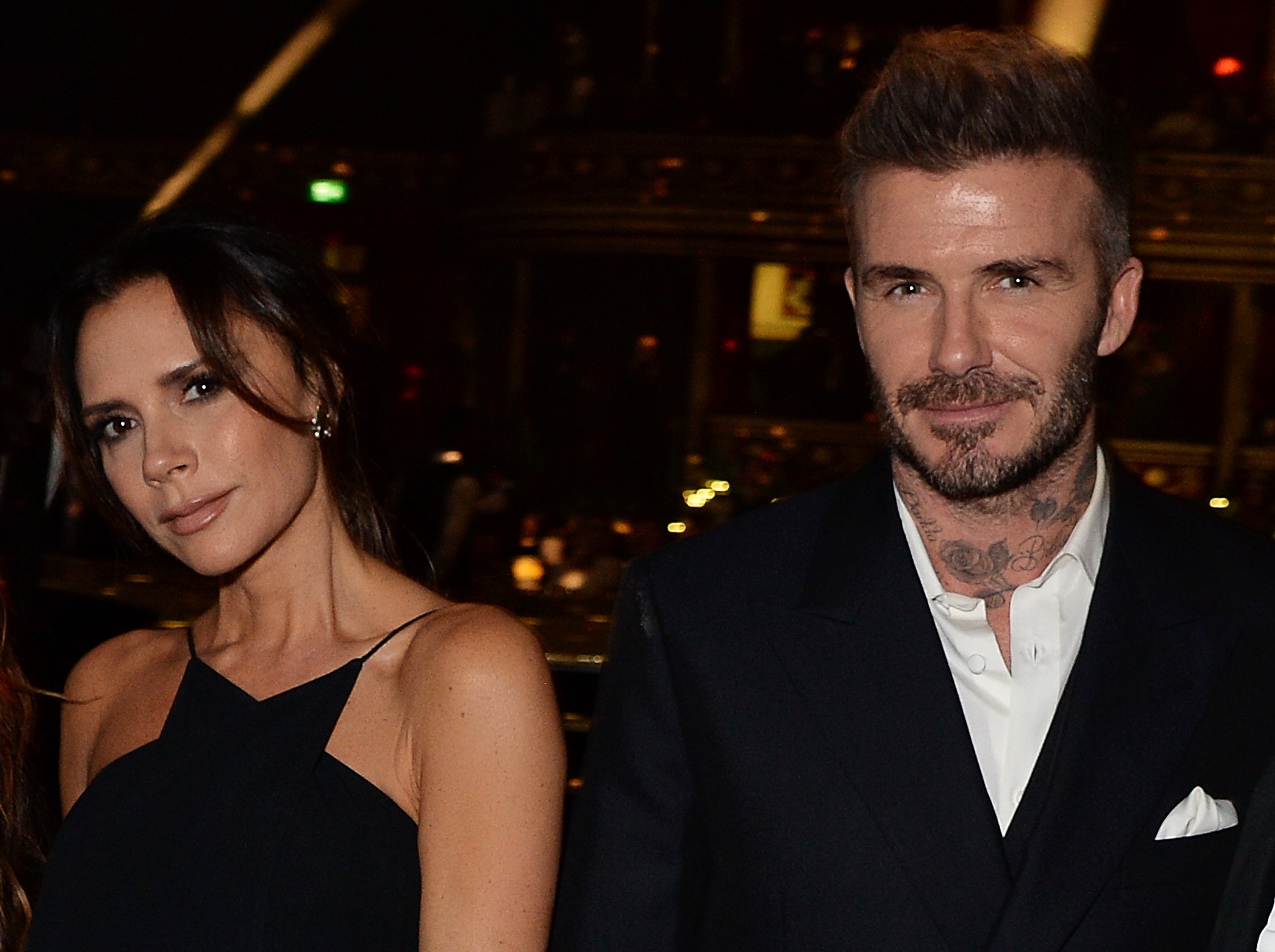 Victoria Beckham and David Beckham pose for a photo together at Fashion Awards