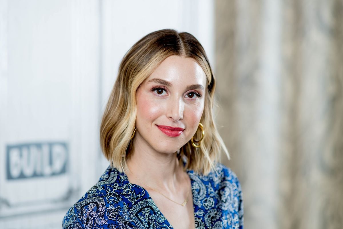 Whitney Port of 'The Hill's New Beginnings' smiles in a blue top with gold earrings