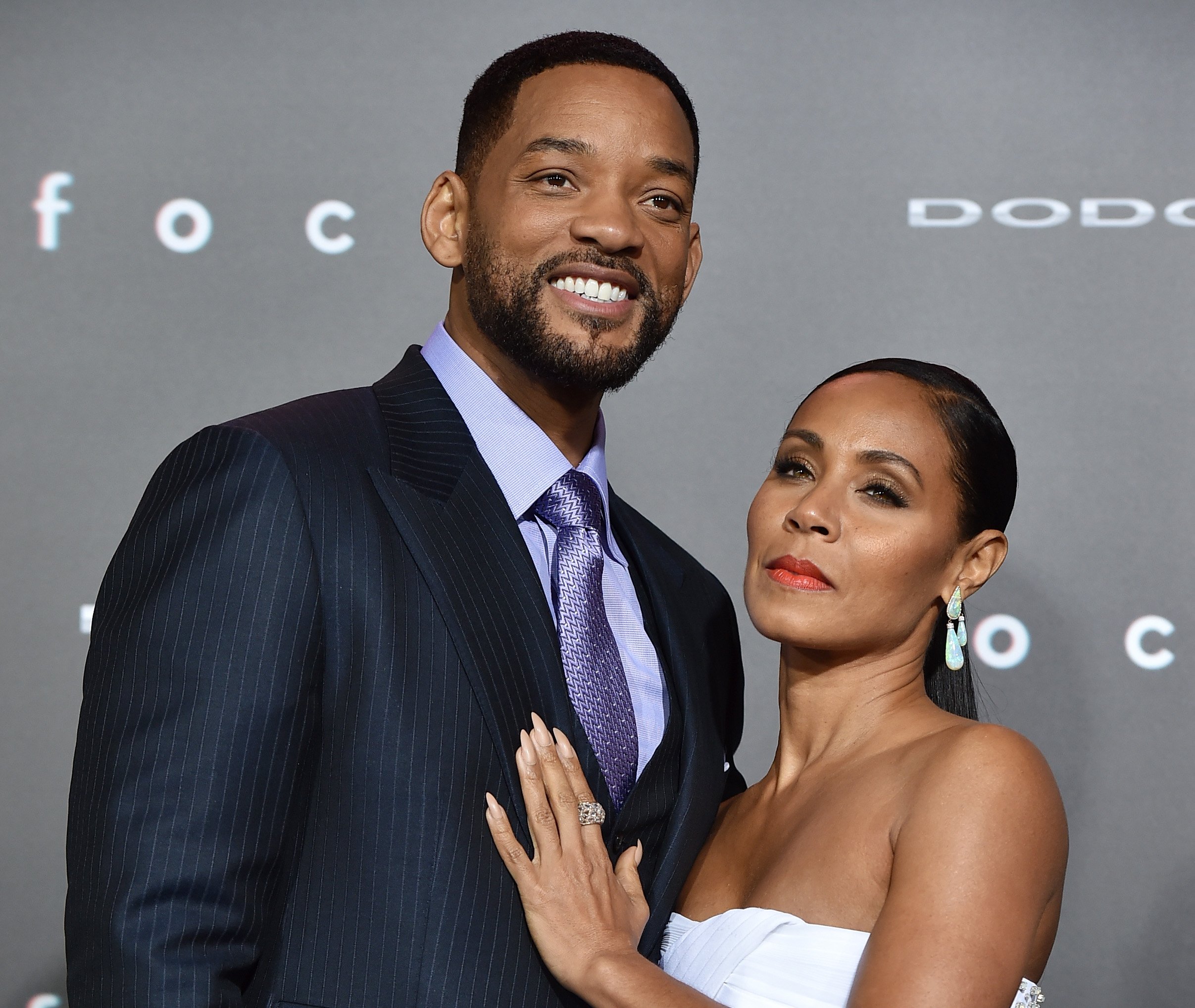 Will Smith and Jada Pinkett Smith posing at a movie premiere in 2015.