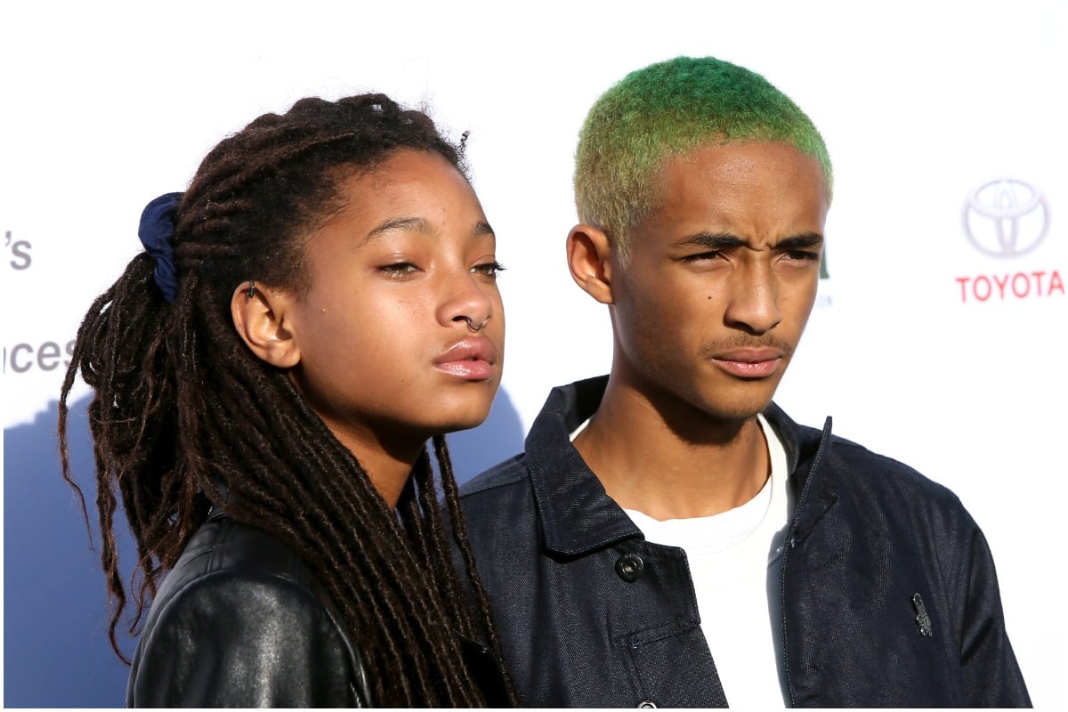 Willow Smith and Jaden Smith squinting and posing at a red carpet event.