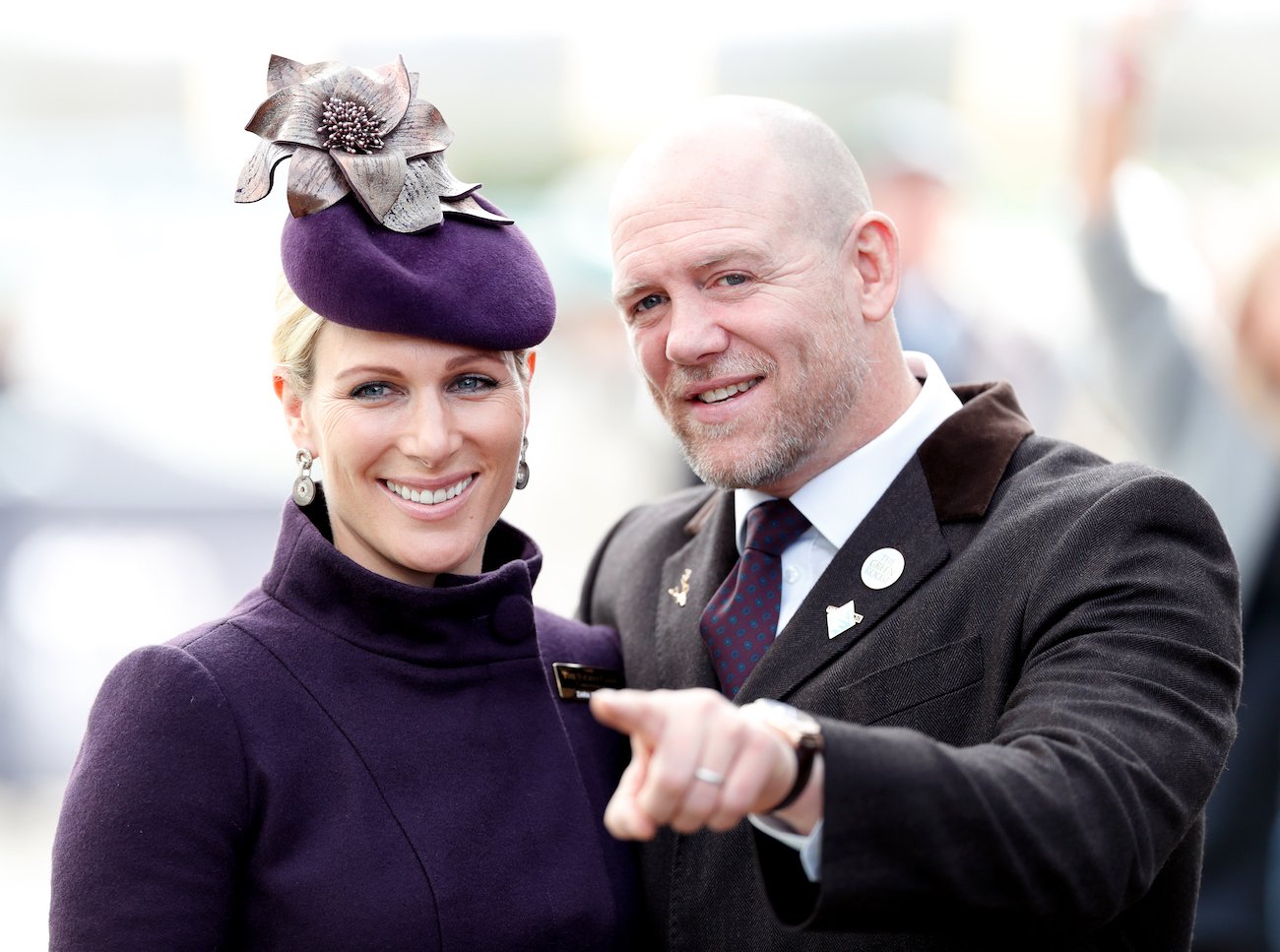 Zara Tindall smiling, Mike Tindall smiling and pointing