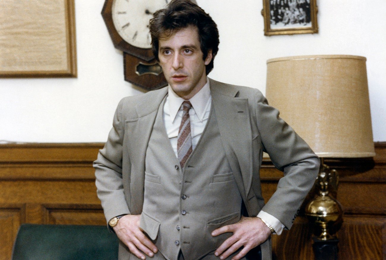 Al Pacino, playing an attorney, stands with his hands on his hips in 'And Justice for All.'