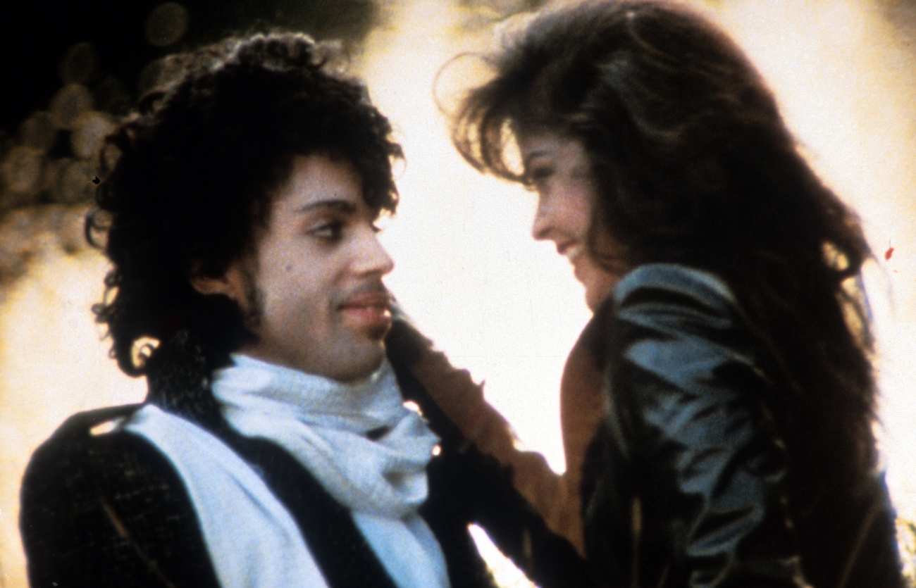 Prince embraces Apollonia Kotero in a scene from the film 'Purple Rain', 1984