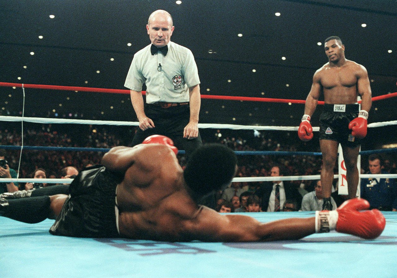 Mike Tyson (R) during his fight against heavyweight champion Trevor Berbick to become the youngest heavyweight world champion in history 