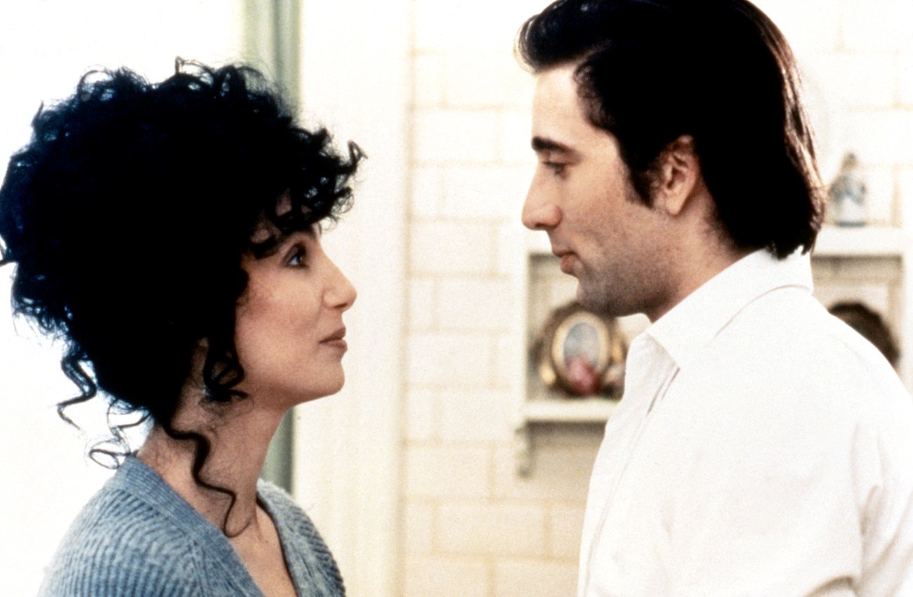 Cher and Nicolas Cage look into each other's eyes in a scene from 'Moonstruck.'