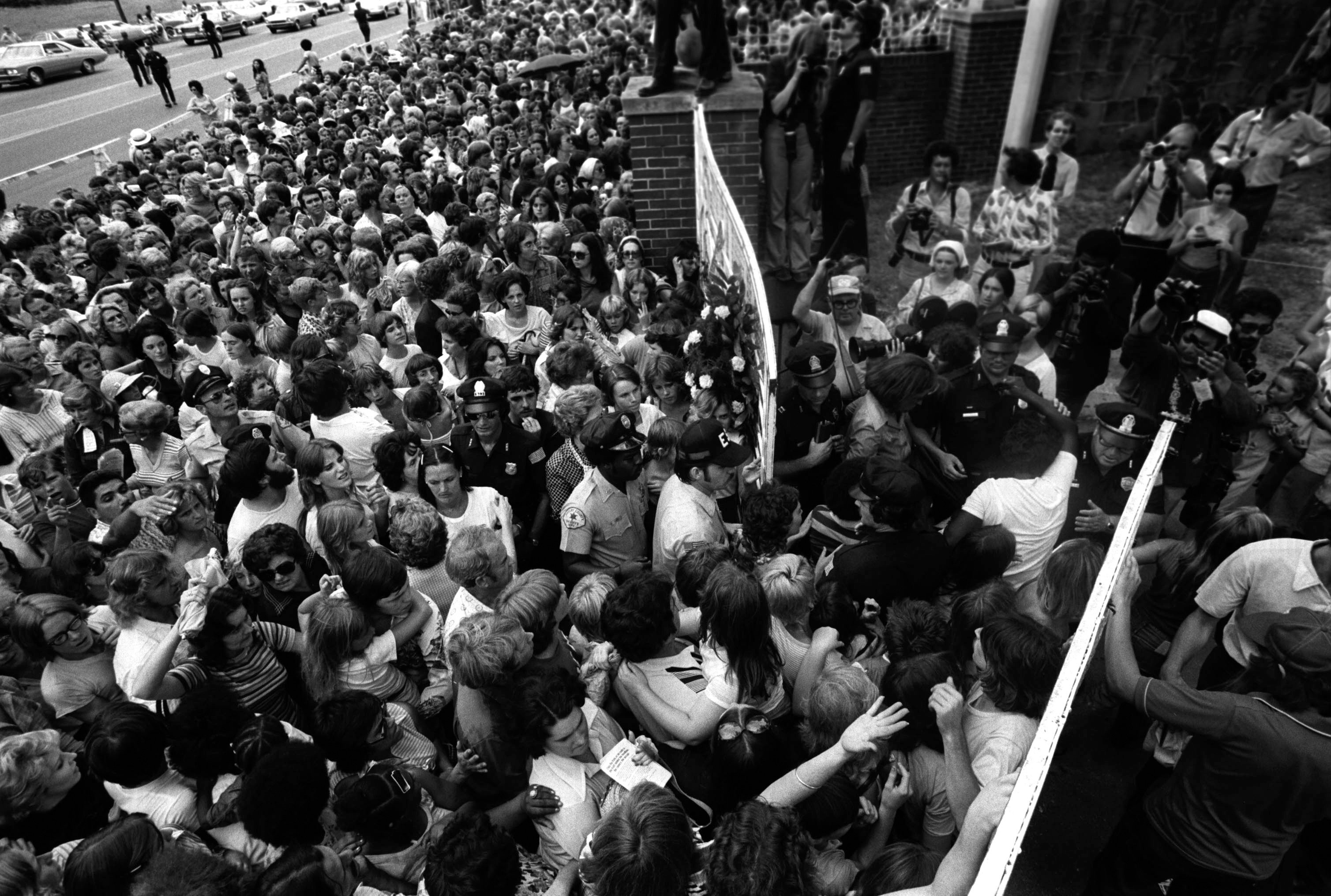 Fans outside the gate of Elvis Presley's Graceland