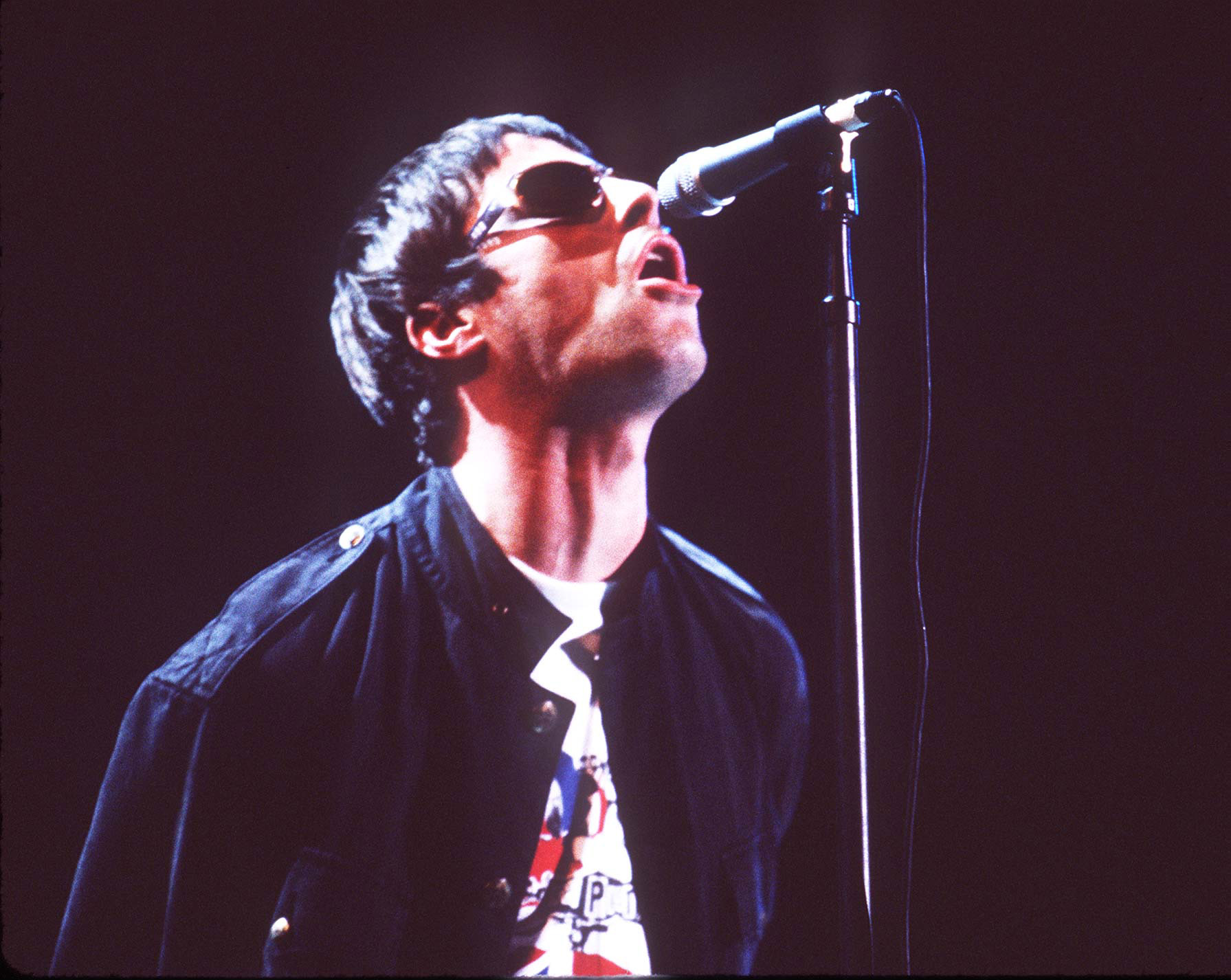 Liam Gallagher of Oasis with a microphone