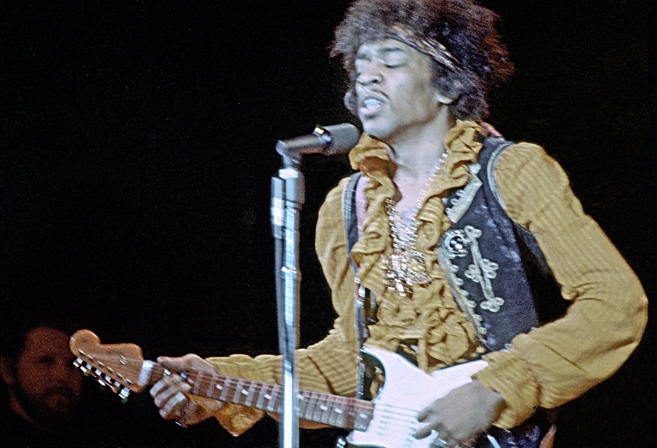 Jimi Hendrix playing guitar on stage at Monterey Pop, 1967