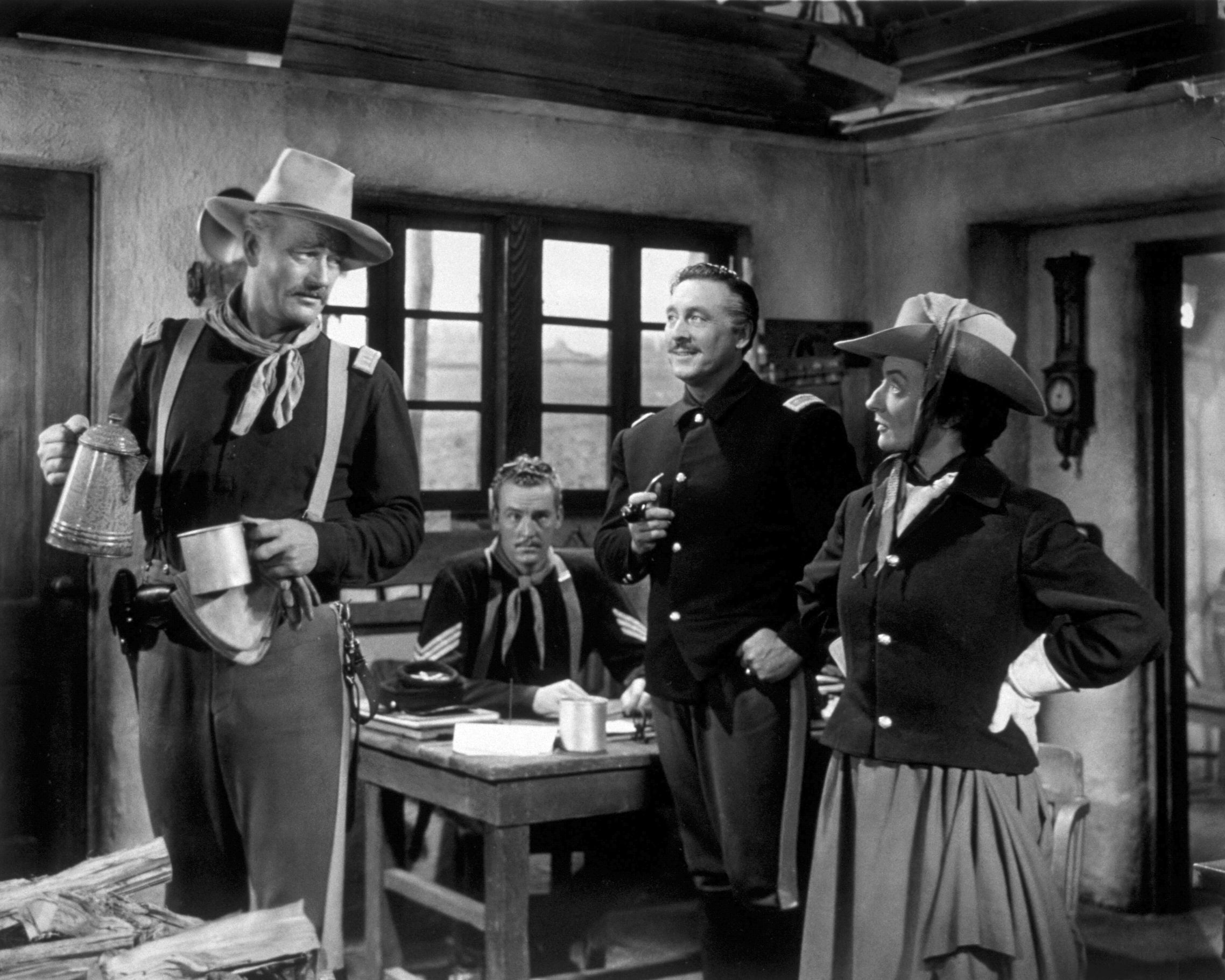 John Wayne and Mildred Natwick in She Wore A Yellow Ribbon near a window