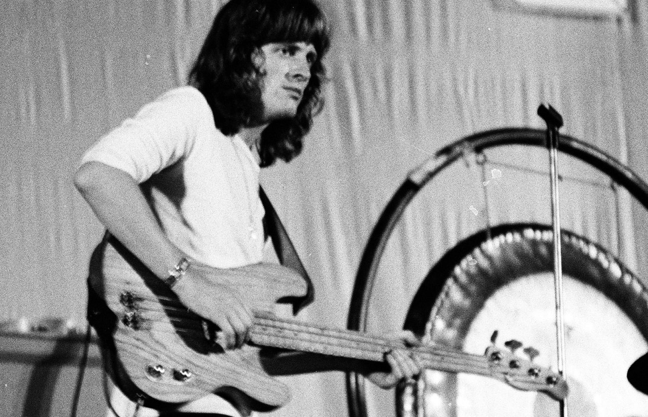John Paul Jones plays bass on stage in 1971.
