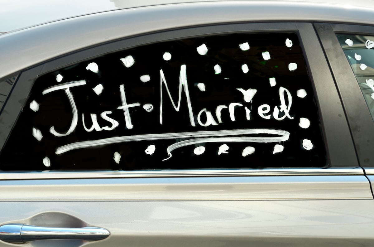 Just married written on the window of a car