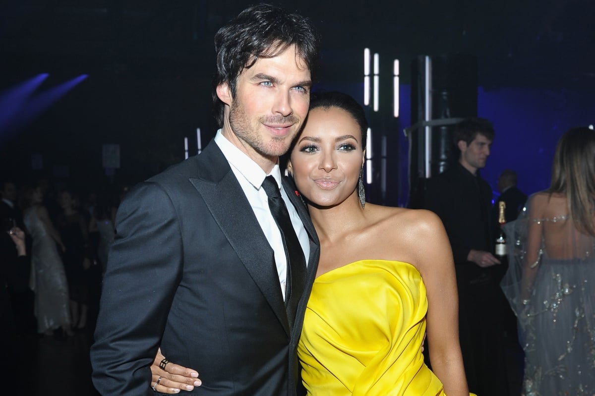 Ian Somerhalder in a suit and Kat Graham wearing a yellow dress