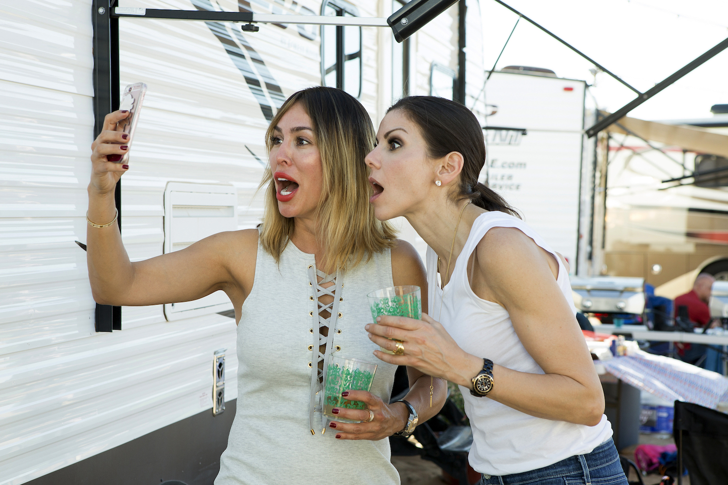 Kelly Dodd and Heather Dubrow filming a scene for 'RHOC' Season 11