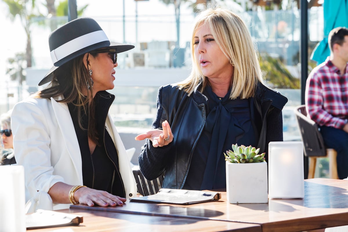 Kelly Dodd and Vicki Gunvalson filming a scene for 'RHOC' Season 13