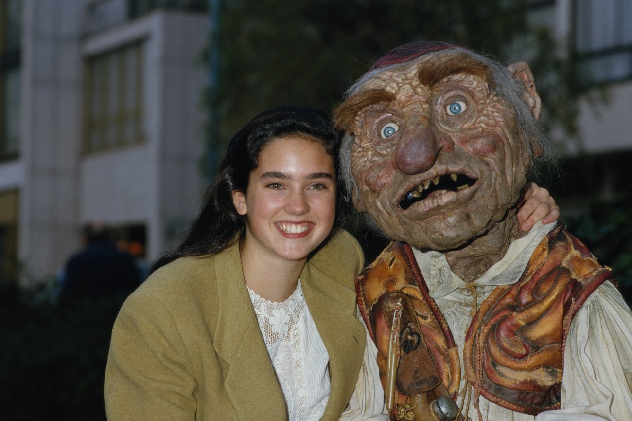 Jennifer Connelly with an actor as dwarf 'Hoggle' during filming of 'Labyrinth' in 1986