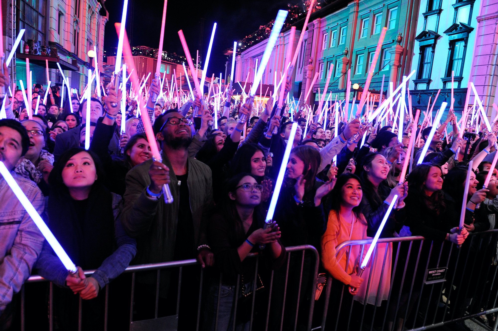 Fans wave Star Wars lightsabers