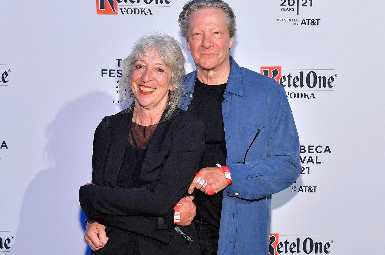 Marianne Leone and Chris Cooper hugging and smiling while posed for the camera at a 2021 Tribeca Festival event