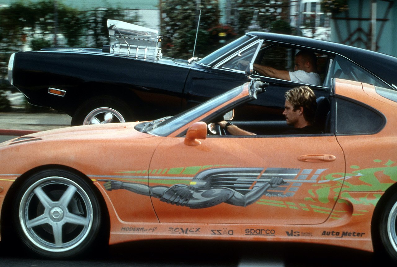 Vin Diesel and Paul Walker racing against each other in a scene from the film 'The Fast And The Furious'
