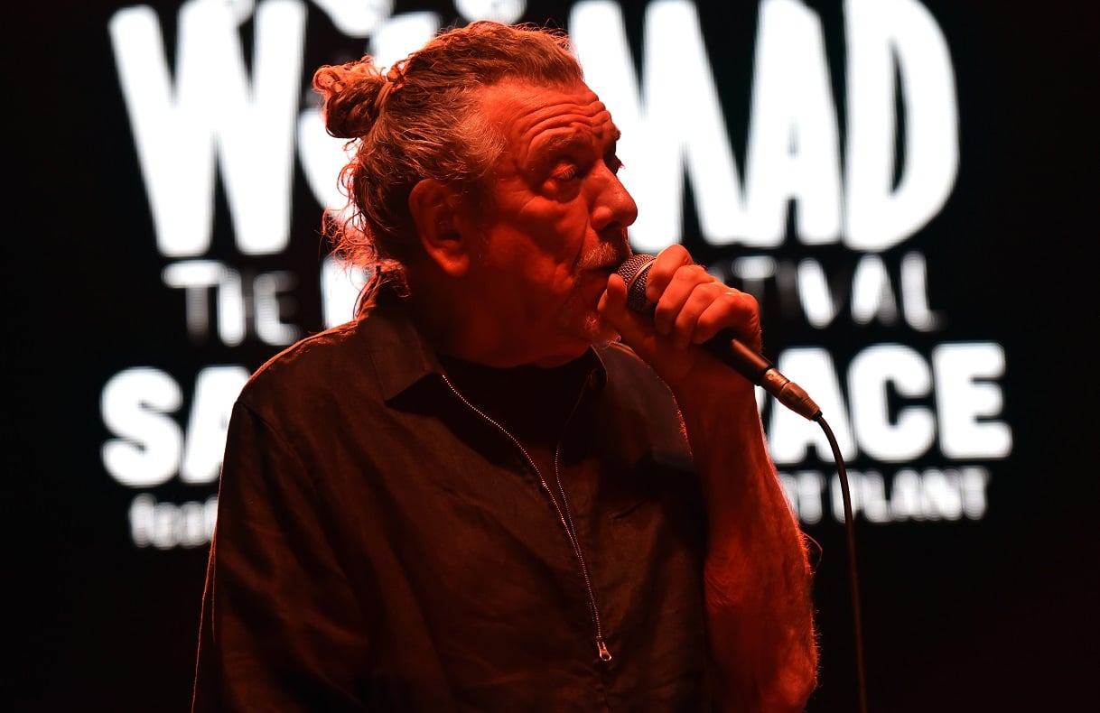 Robert Plant singing into a microphone on stage in 2019
