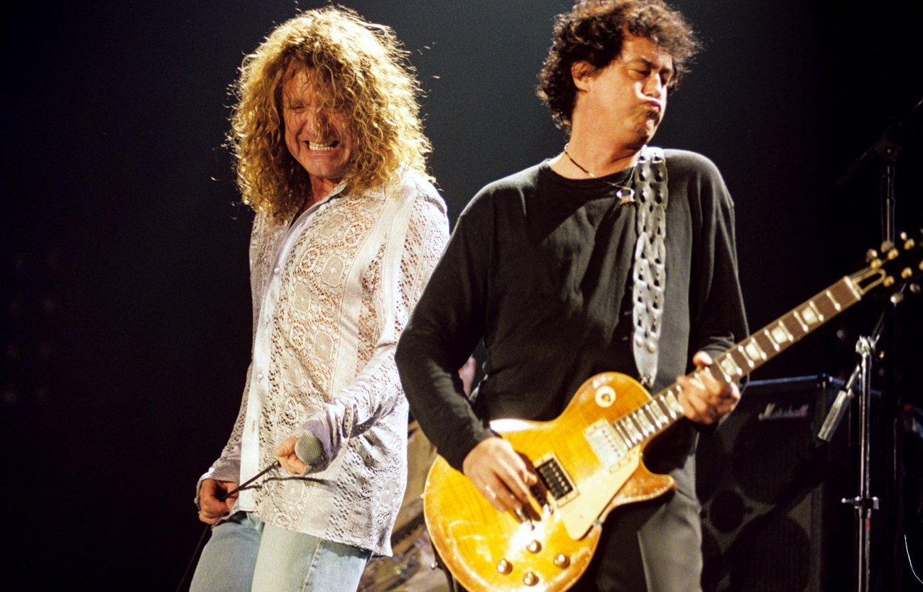 Robert Plant and Jimmy Page perform on stage in 1998