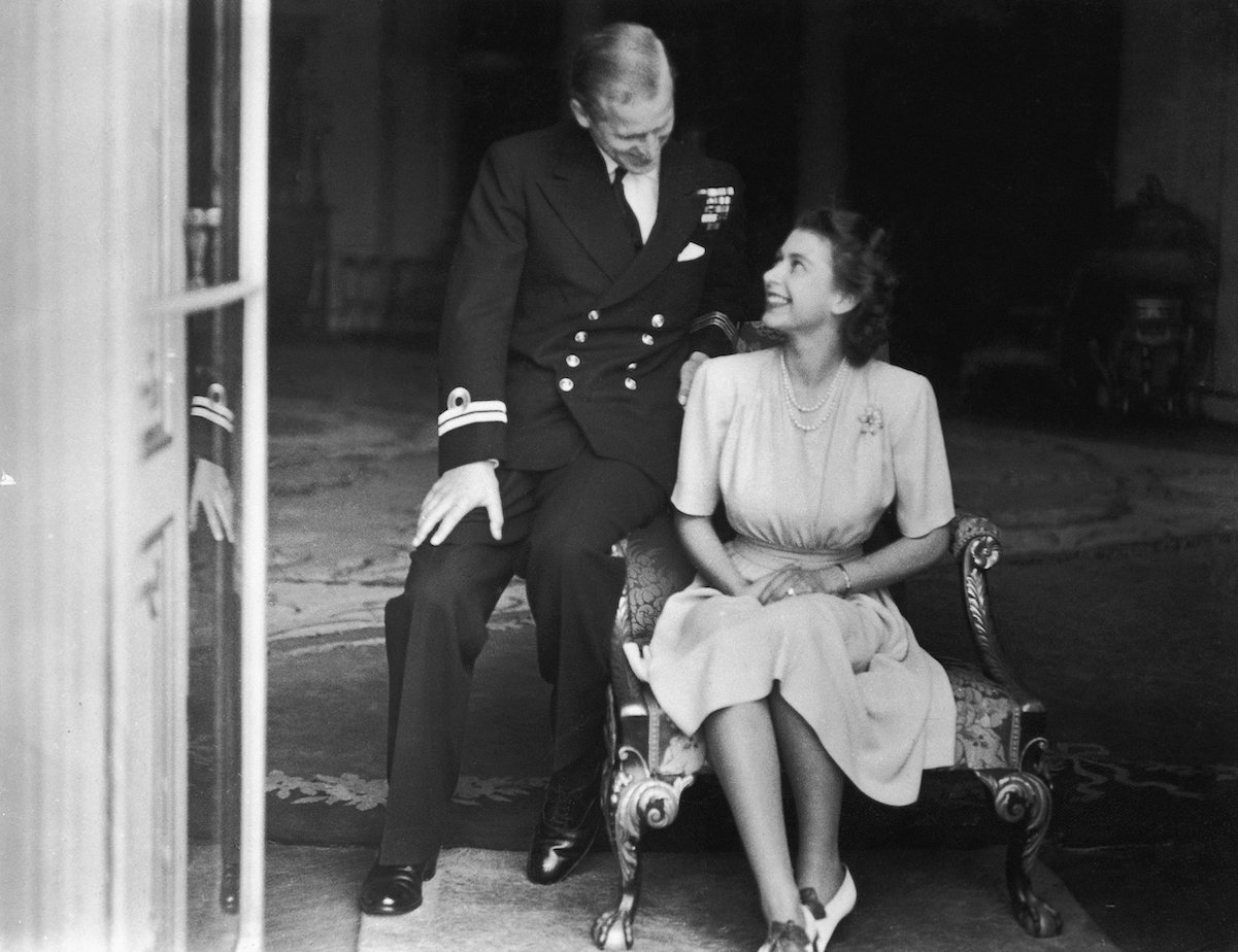 Queen Elizabeth and Prince Philip gaze lovingly at one another during their engagement announcement in 1947.