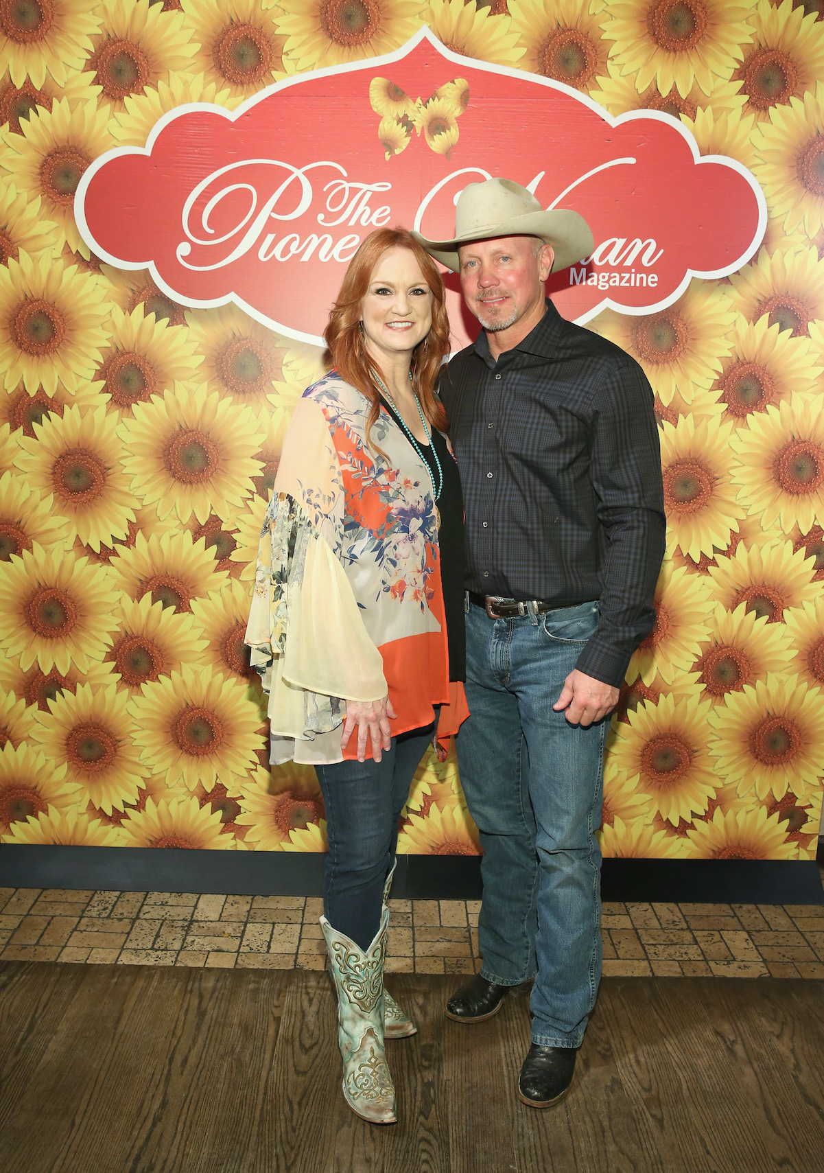 'The Pioneer Woman' star Ree Drummond with her husband, Ladd Drummond pose at an event for 'Pioneer Woman Magazine.'