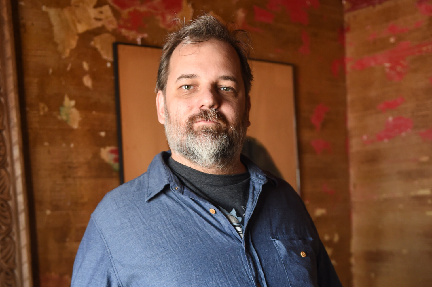 A close-up of Dan Harmon in a blue button-down shirt.