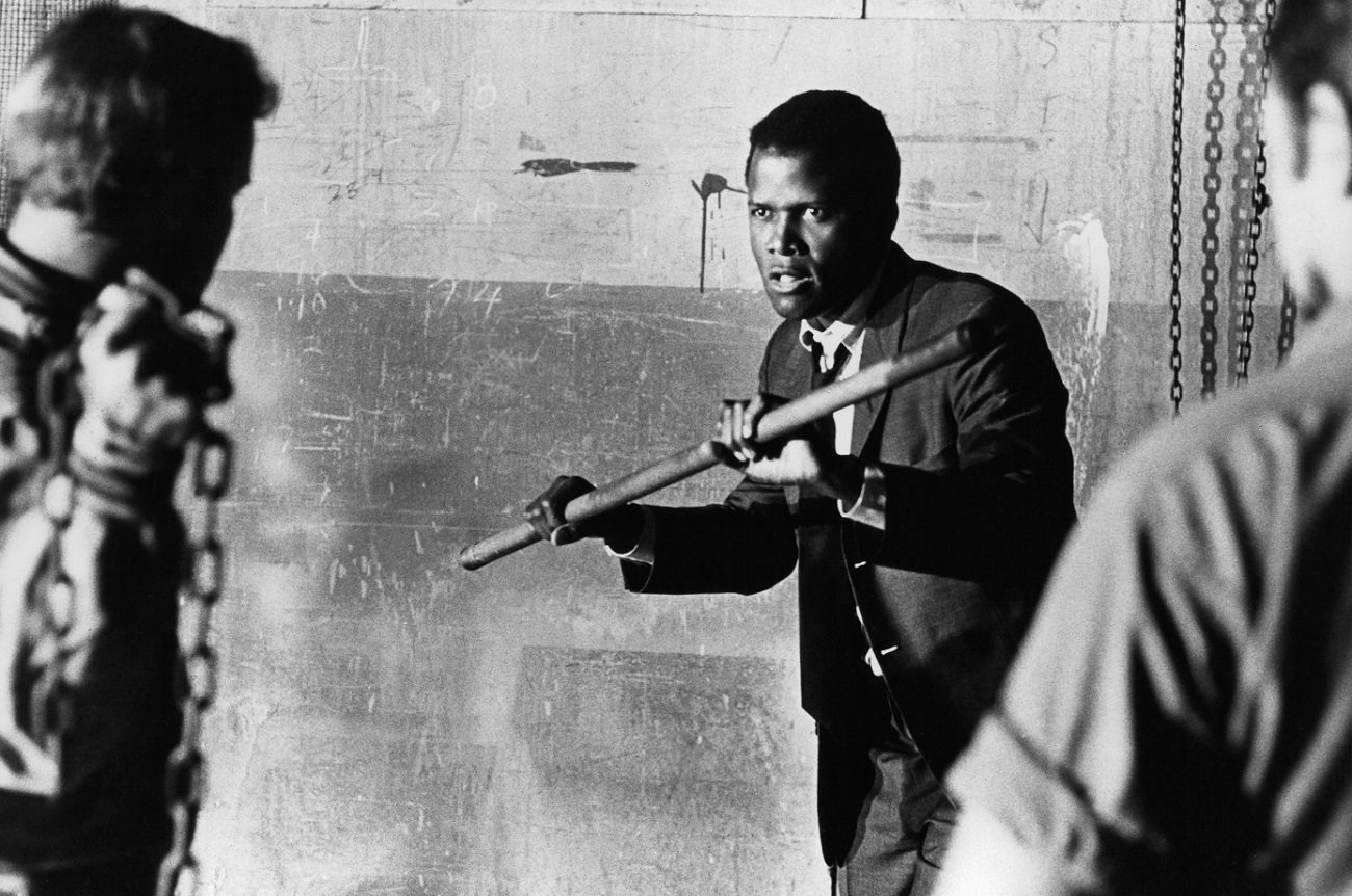 Sidney Poitier fights off attackers with a metal pipe in a scene from 'In the Heat of the Night.'