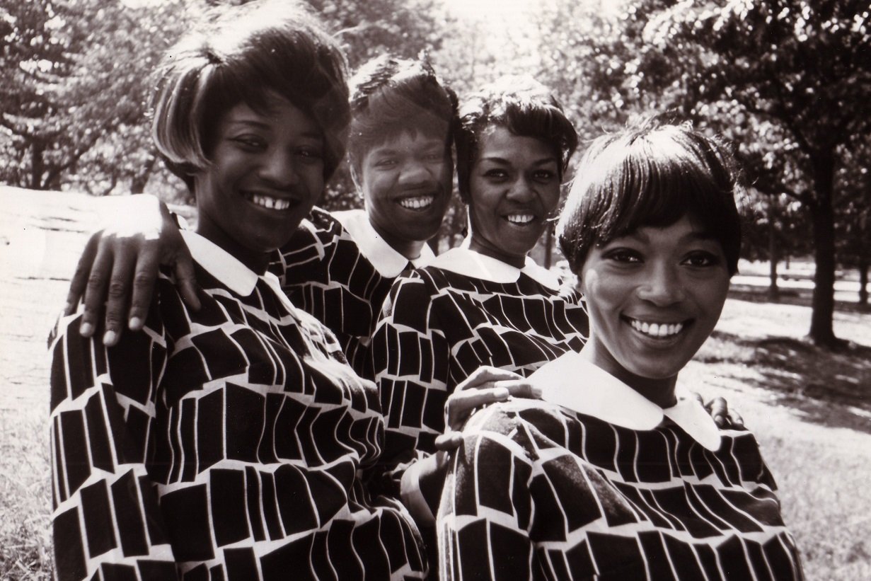 The Sweet Inspirations pose and smile for a photo in a park, 1967.