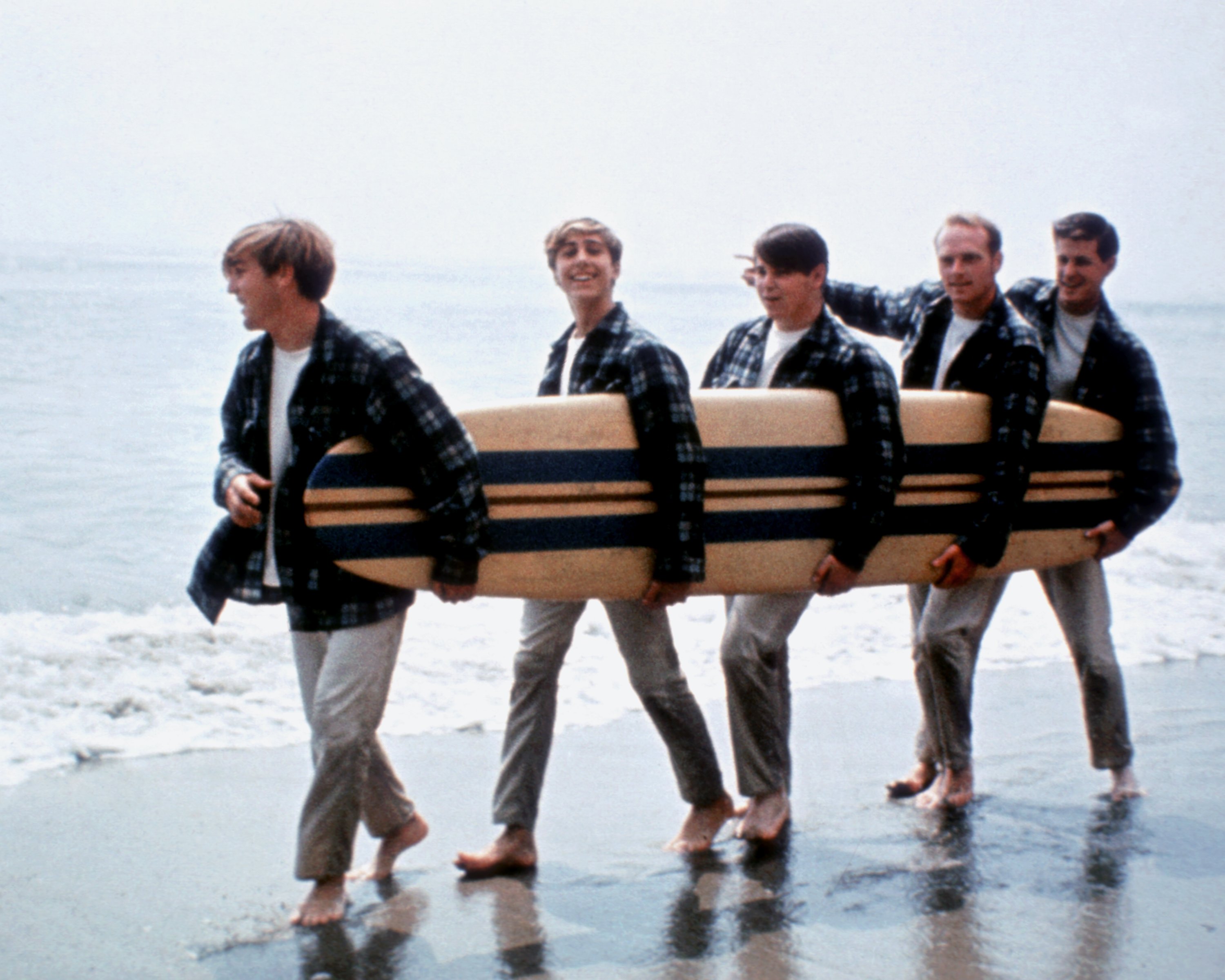 The Beach Boys with a surf board