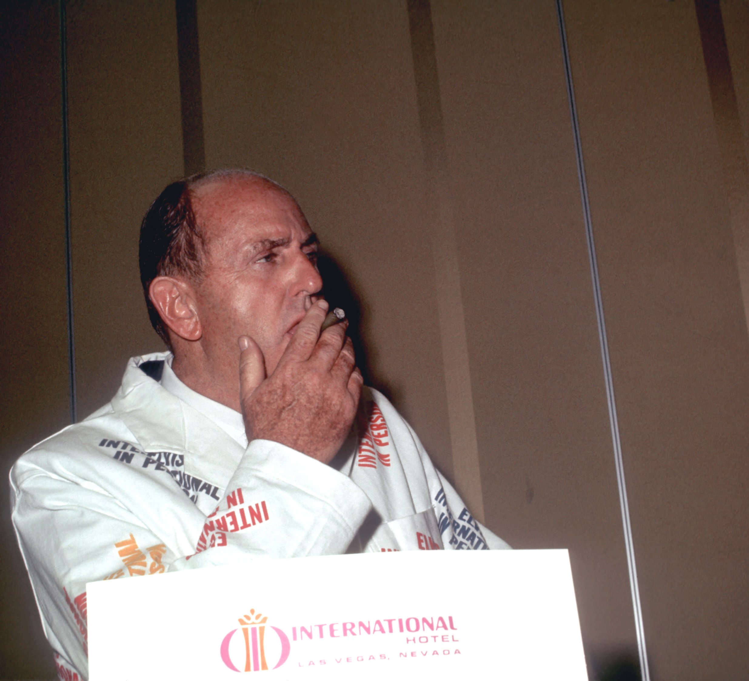 Colonel Tom Parker wearing white