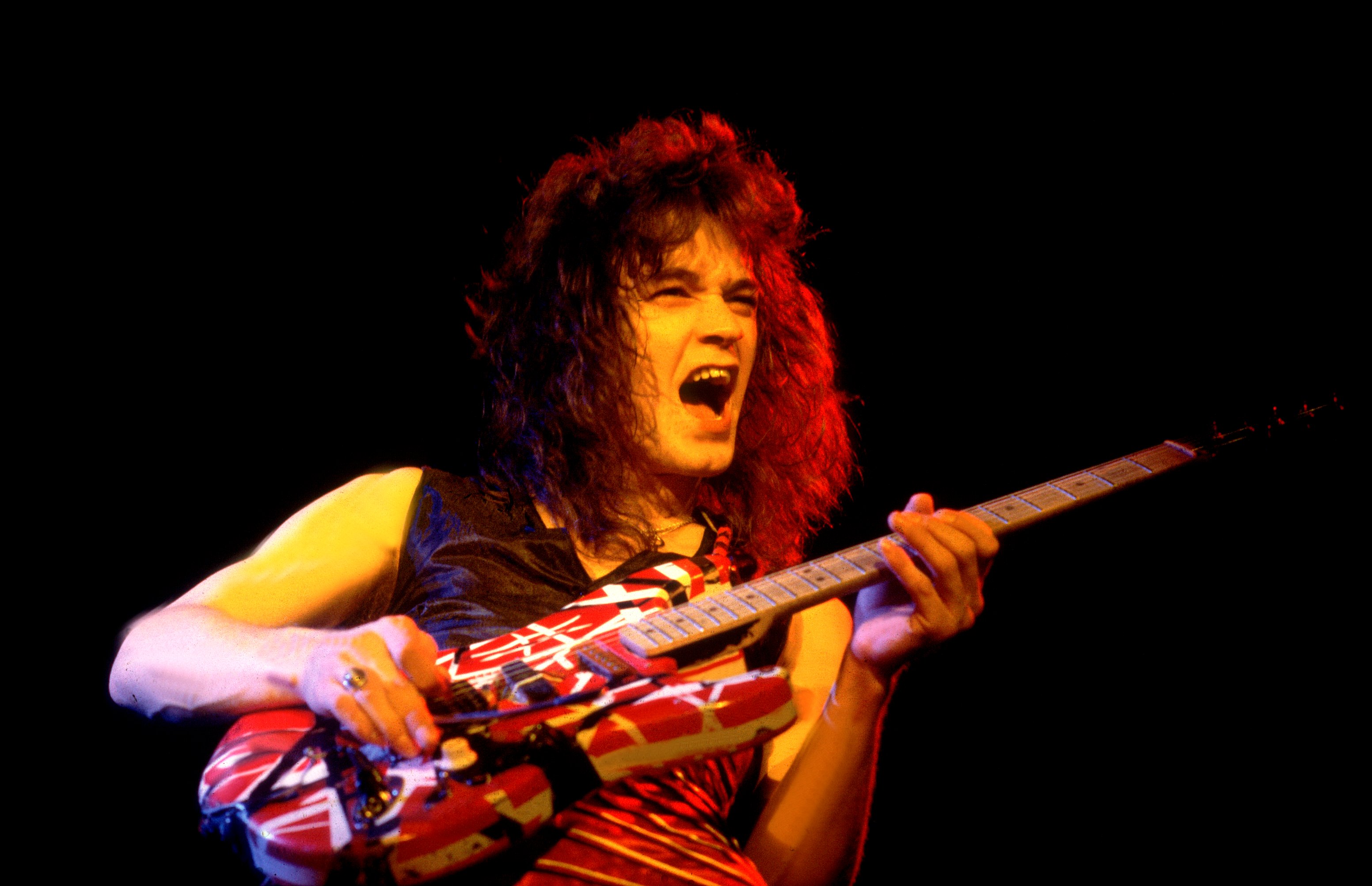 Dutch-born American Rock musician Eddie Van Halen (1955 - 2020), of the group Van Halen, performs onstage at the Aragon Ballroom, Chicago, Illinois, April 26, 1979.