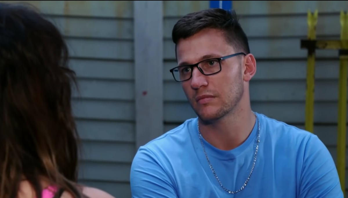 '90 Day Fiancé' couple Tiffany and Ronald. Ronald is wearing a blue shirt and glasses