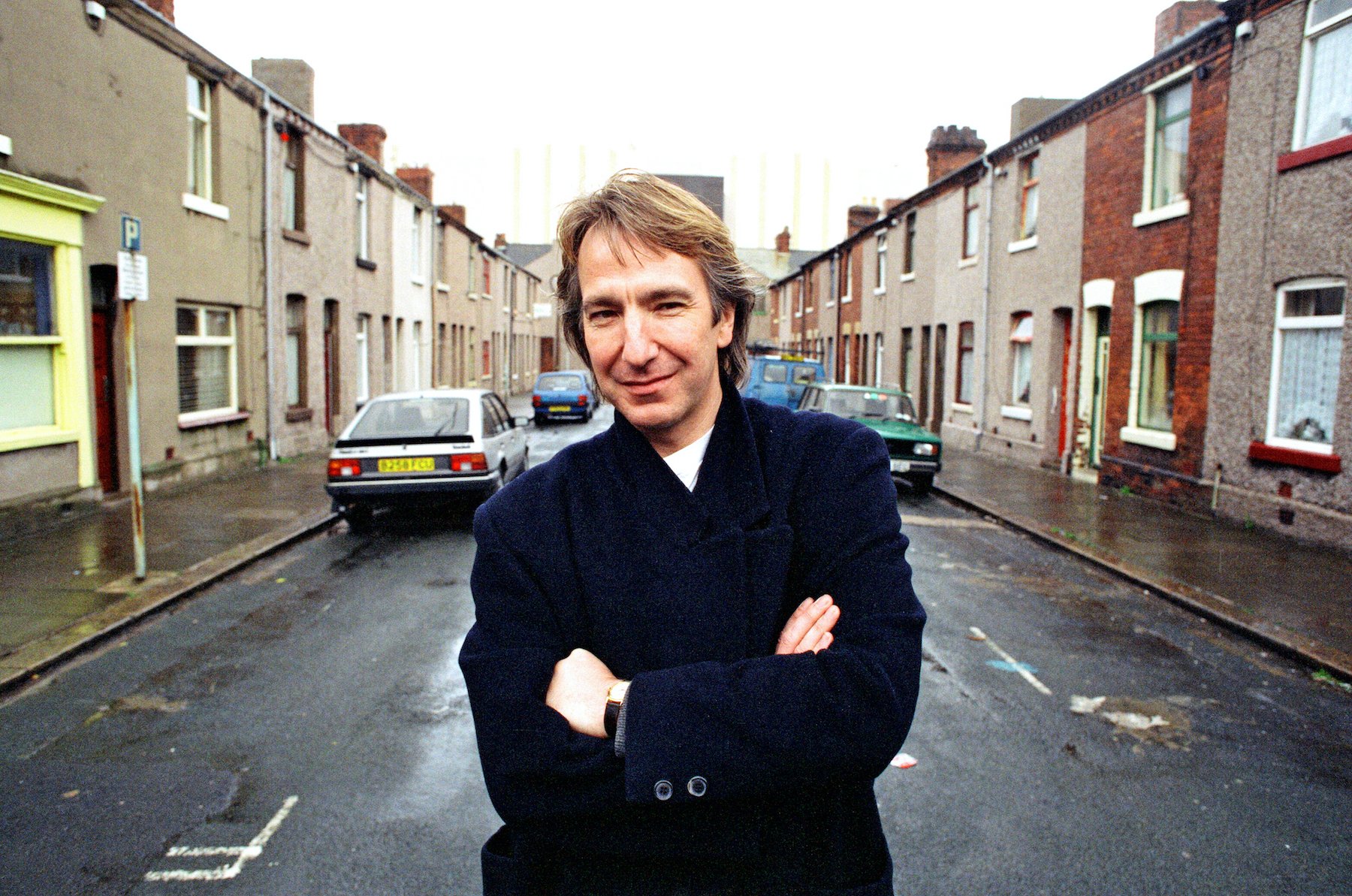 Alan Rickman smiling, pictured on the streets of Barrow In Furness