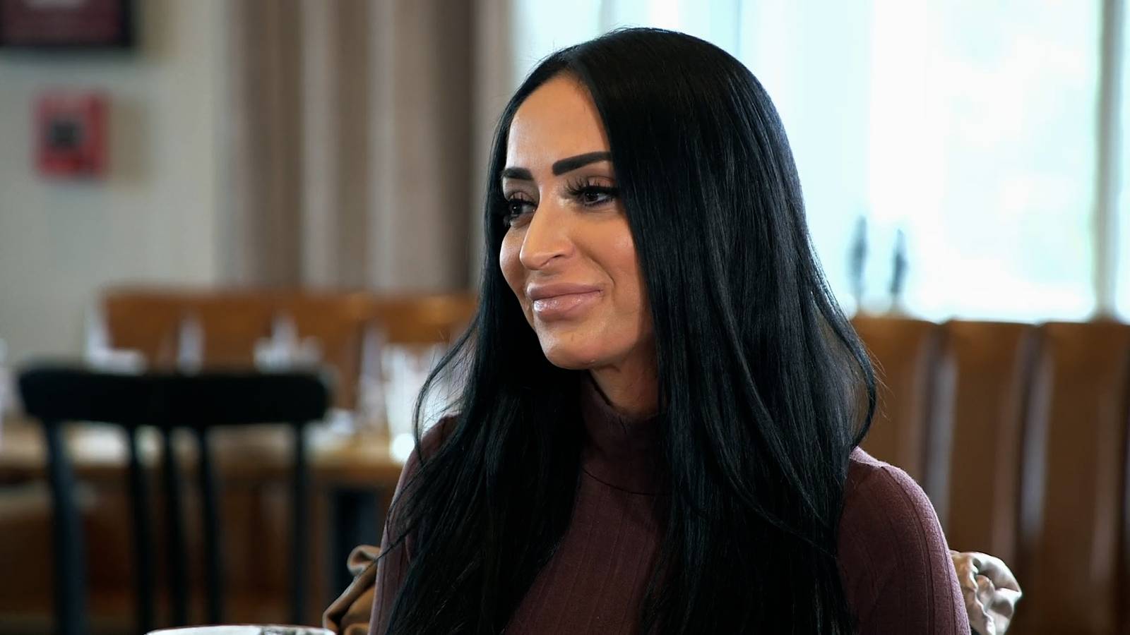 Angelina Pivarnick from 'Jersey Shore: Family Vacation' smirks in Season 4