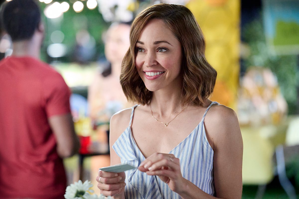 Autumn Reeser smiling in the Hallmark movie 'The 27-Hour Day'