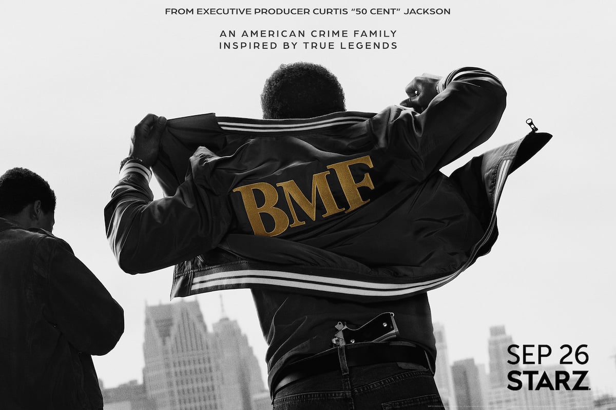 A figure wearing a BMF jacket with a gun tucked into his belt has his back toward the camera with a another figure off to the side in the BMF poster